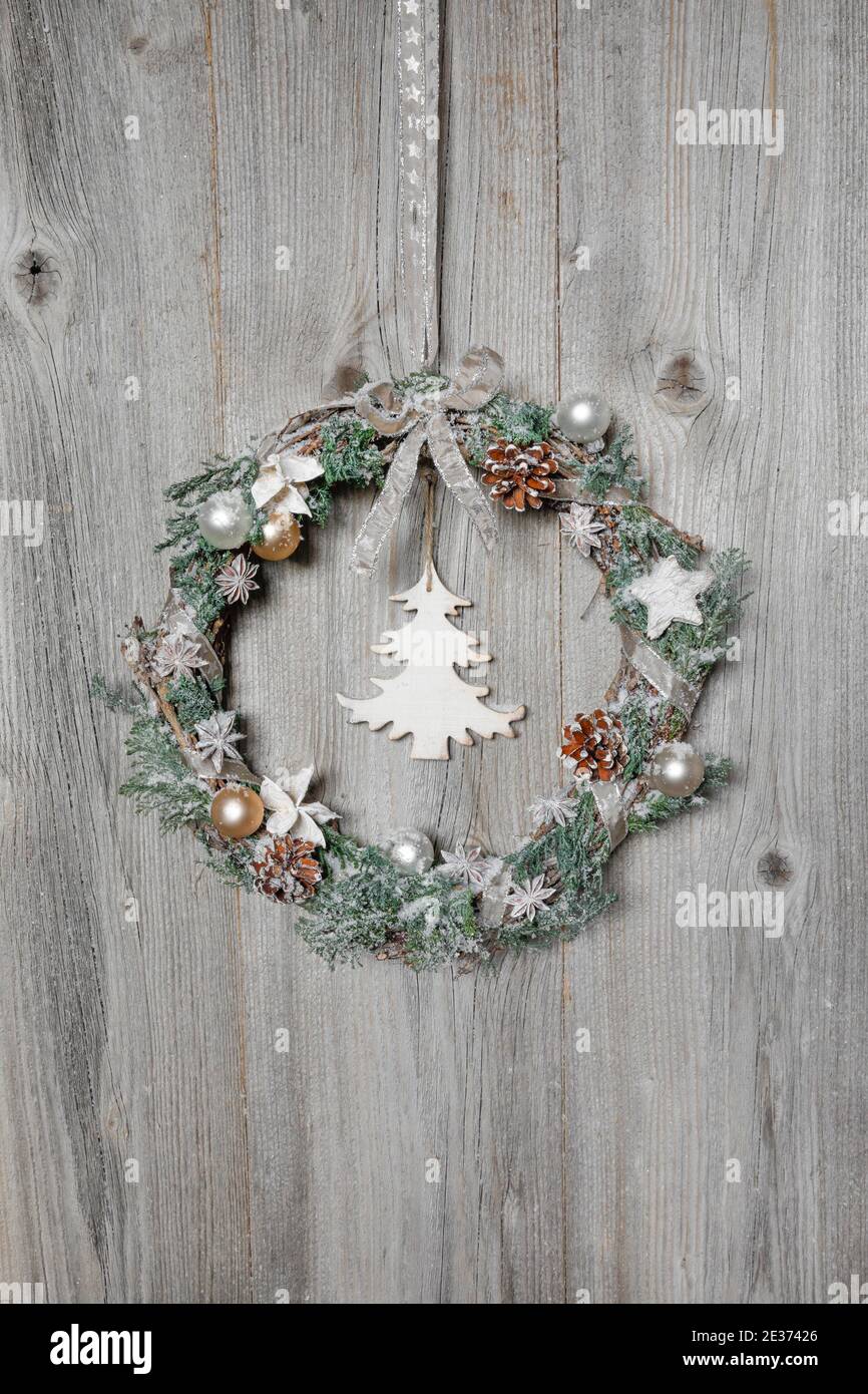 Christmas wreath on wooden wall Stock Photo