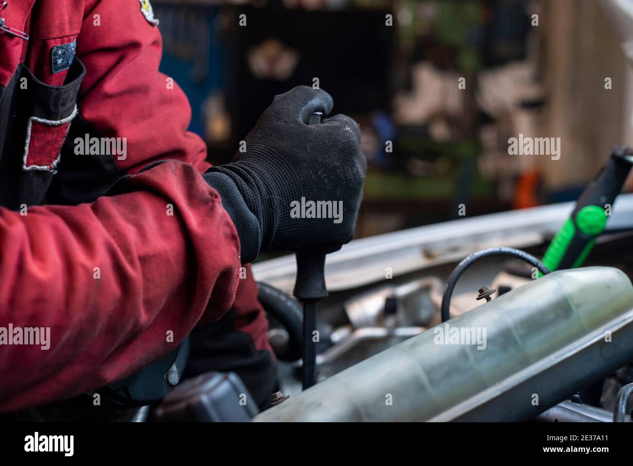 Mechanic hand at work on the engine Stock Photo - Alamy