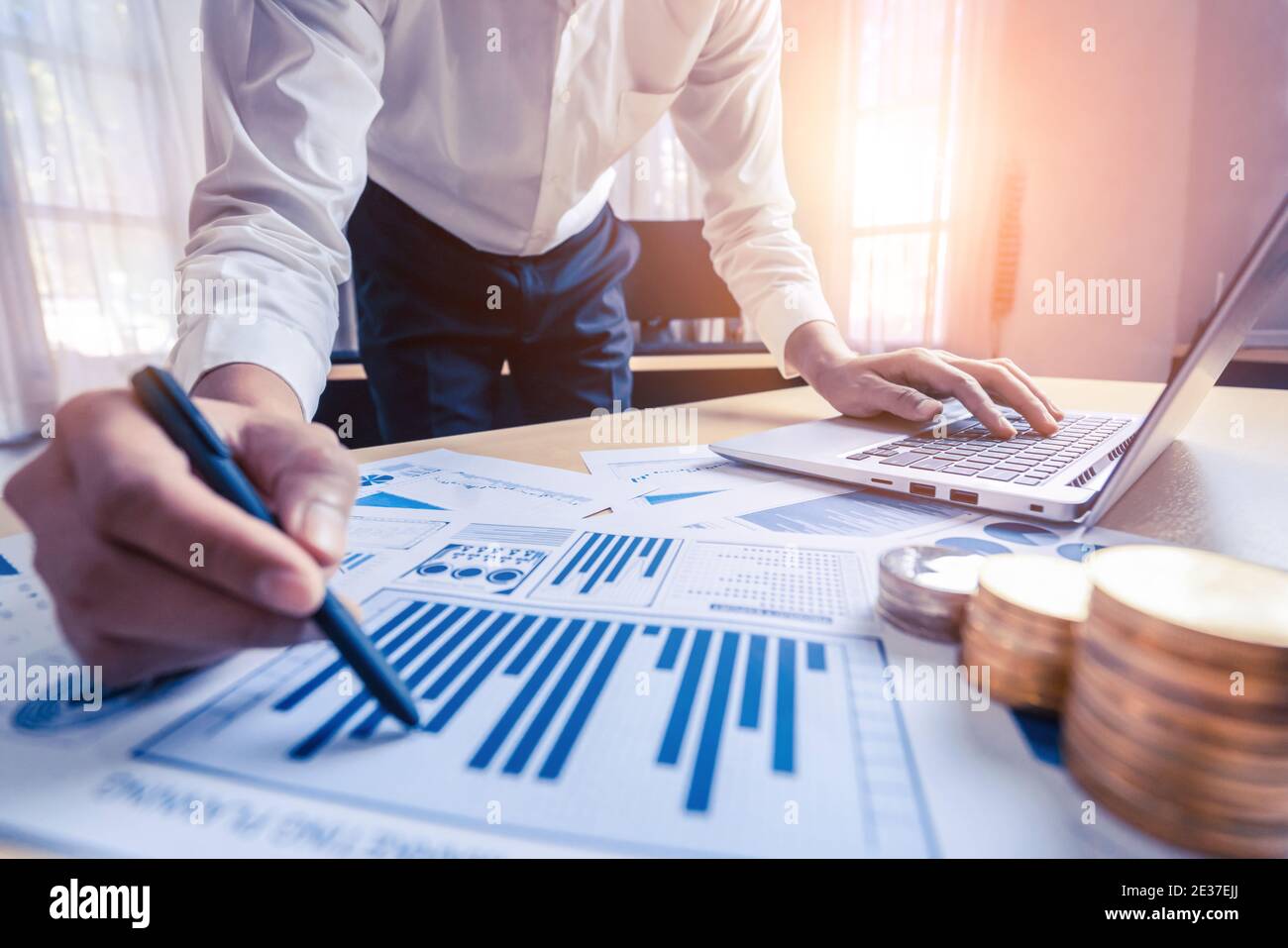 Businessman accountant or financial expert analyze business report graph and finance chart at corporate office. Concept of finance economy, banking Stock Photo