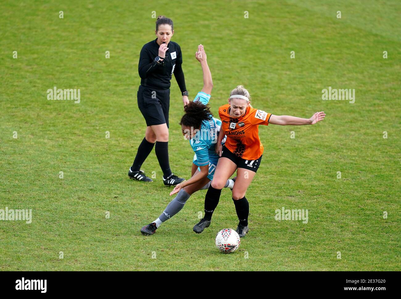 London City's Atlanta Primus and London Bees' Charlie Estcourt (right) battle for the ball as referee Georgia Ball looks on during the FA Women's Championship match at The Hive, Barnet. Stock Photo