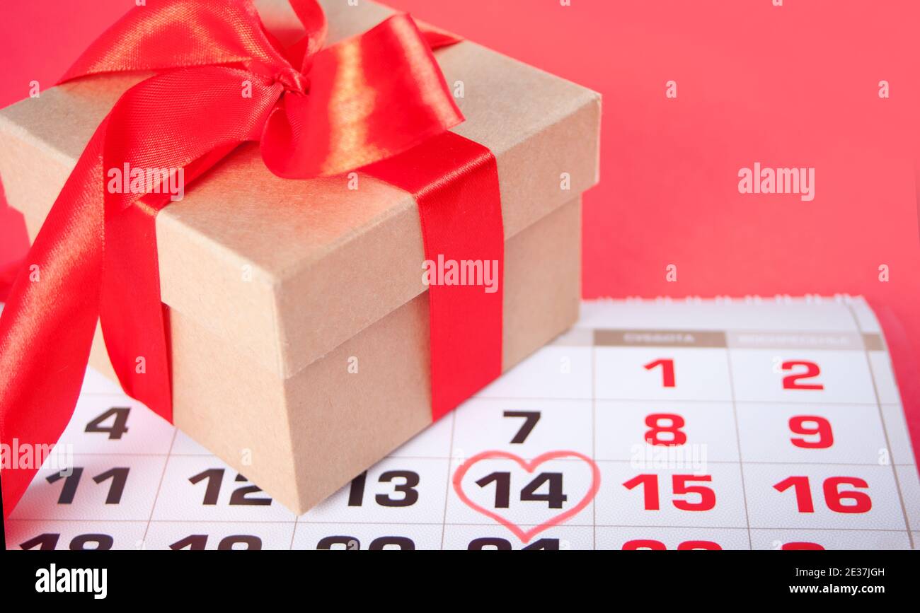 Date of February 14 on the calendar with gift box Valentine s day Date of February 14 on the calendar with gift box Valentine s day