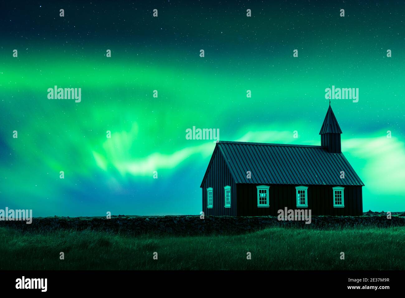 Aurora borealis Northern lights over famous picturesque black church of Budir at Snaefellsnes peninsula region in Iceland. Landscape photography. Courtesy of NASA. Photo collage Stock Photo