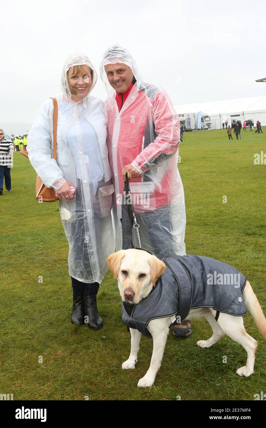 Scottish International Airshow . Sunday 4th Sept 2017 .Low Green, Ayr, Ayrshire, Scotland, UK . A wet afternoon at the airshow. Couple in plastic rainwear with dog also in rain coat Stock Photo