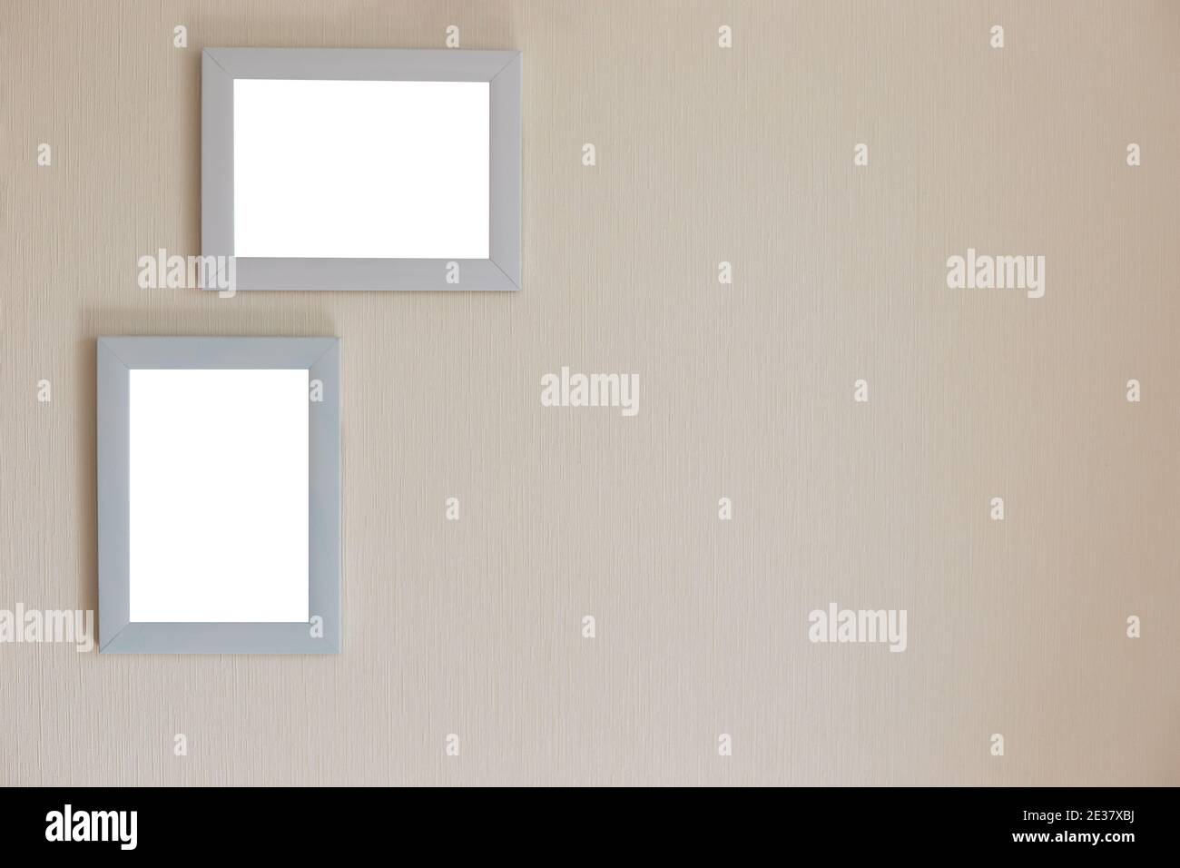 Two white frames on a beige wall Stock Photo Alamy