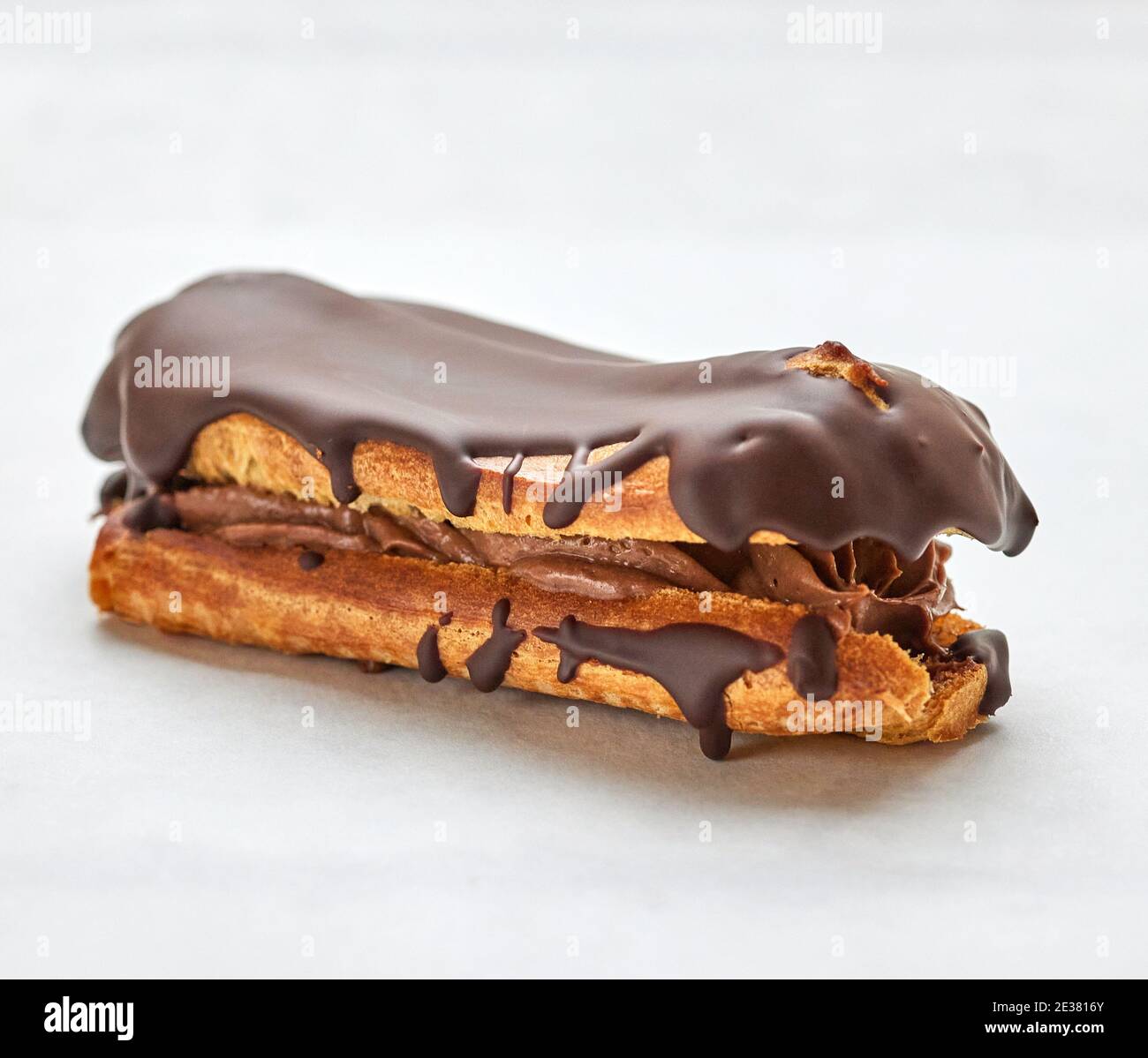 freshly baked eclair on white background Stock Photo