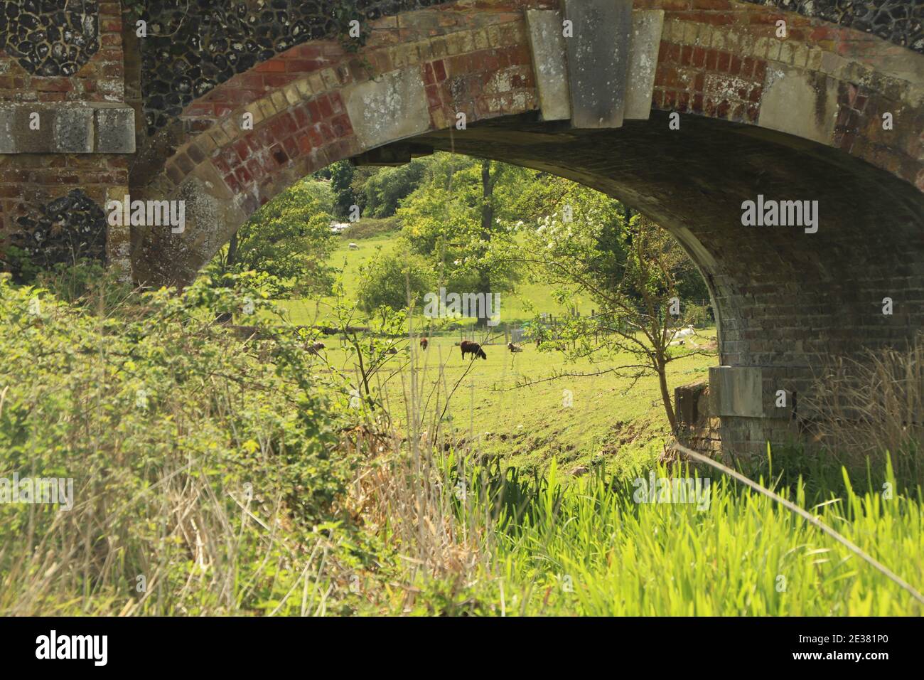 Solid brickwork of a bridge across a stream Stock Photo - Alamy