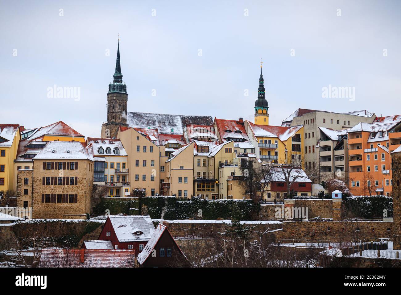 Bautzen oldtown during winter season snow, ice towers old buildings houses, german, tower, spree, water river, cold dark, blue Stock Photo