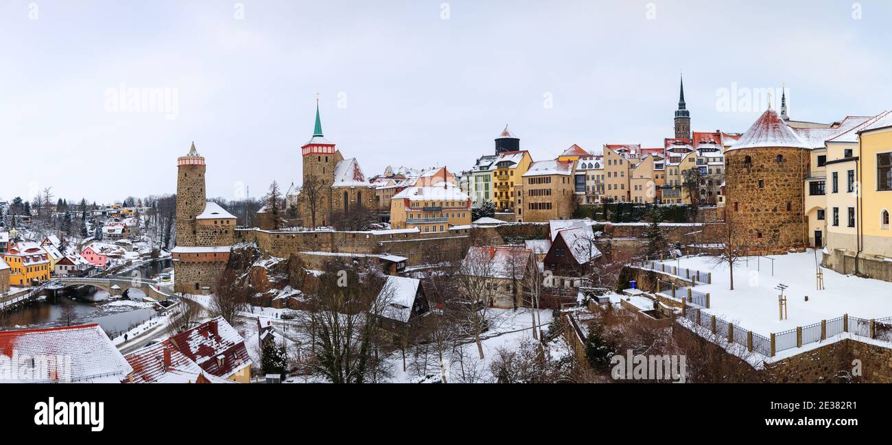 Bautzen oldtown during winter season snow, ice towers old buildings houses, german, tower, spree, water river, cold dark, blue Stock Photo