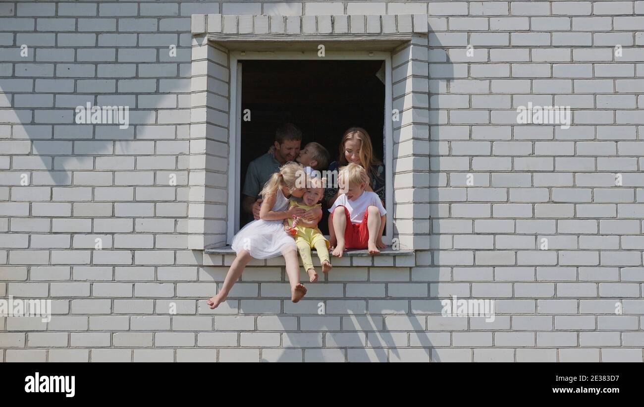 The concept of a large family. A friendly family hugs each other in the ...