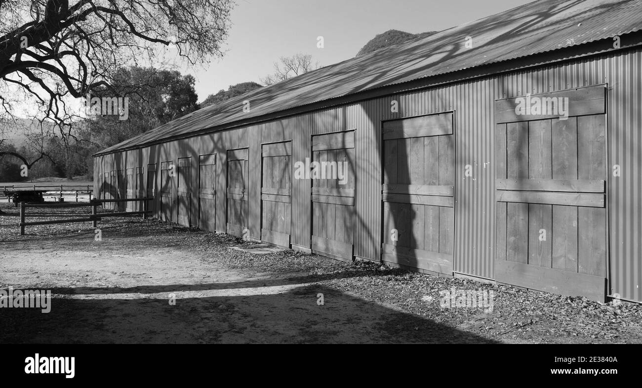 Black and White view of rustic historic movie town barn at the Santa Monica Mountains National Recreation Area Paramount Ranch site near Los Angeles C Stock Photo