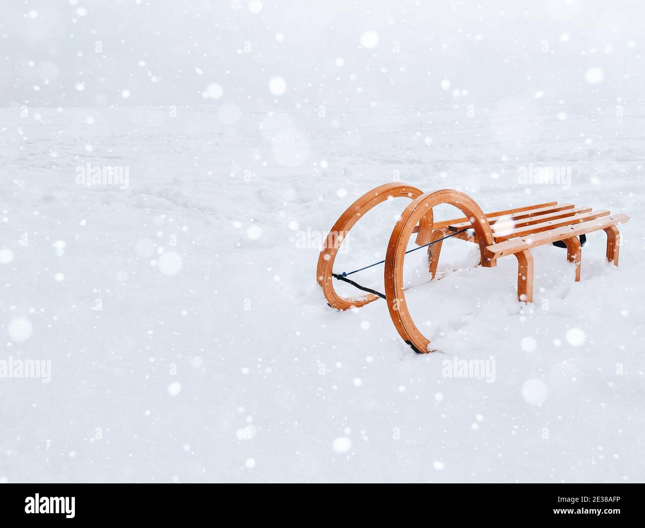 Vintage classic wooden sled for snow riding and sledding winter fun