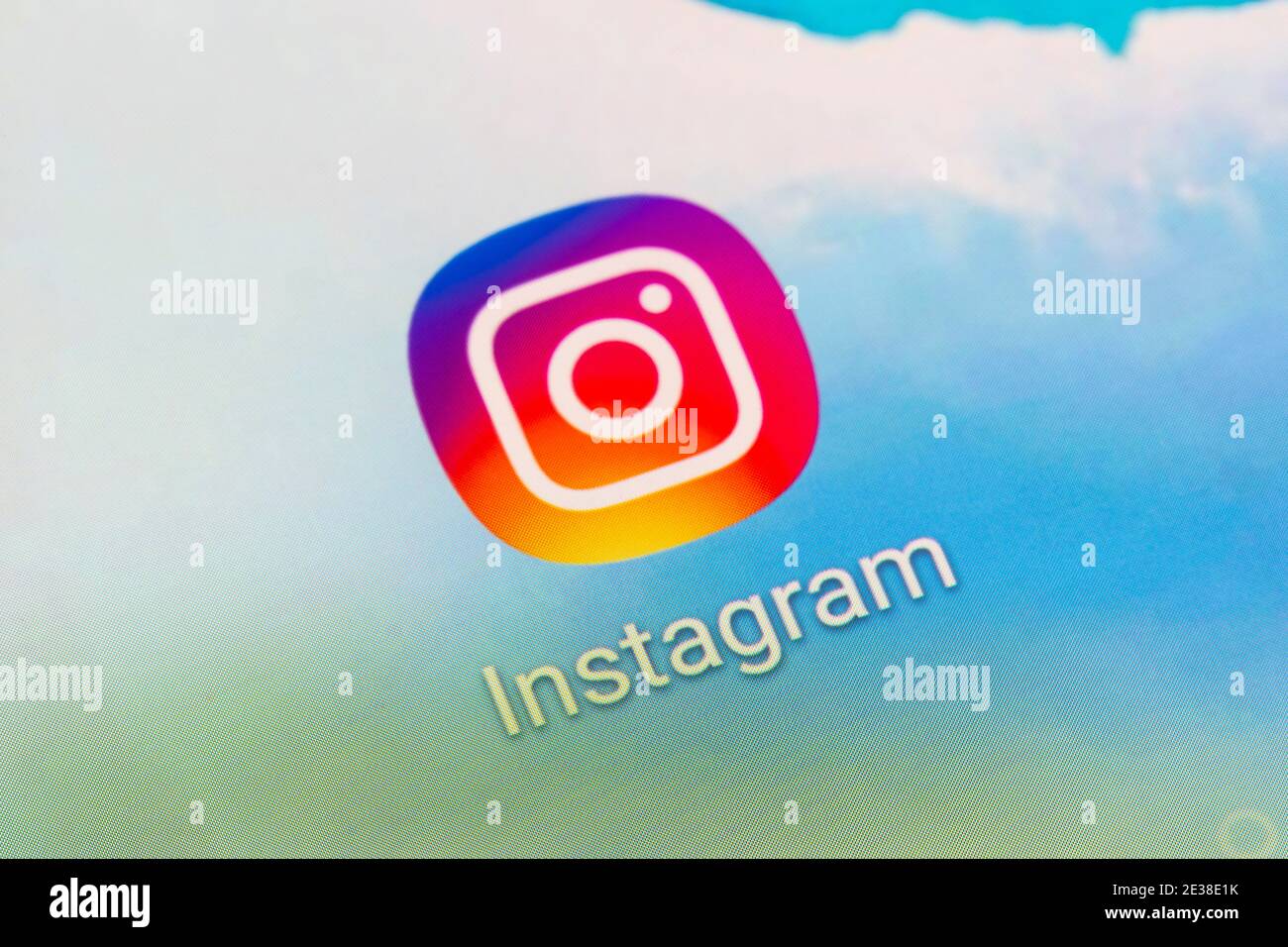 A closeup of the app logo for the American Instagram photo and video sharing social networking service owned by Facebook on a smartphone screen Stock Photo