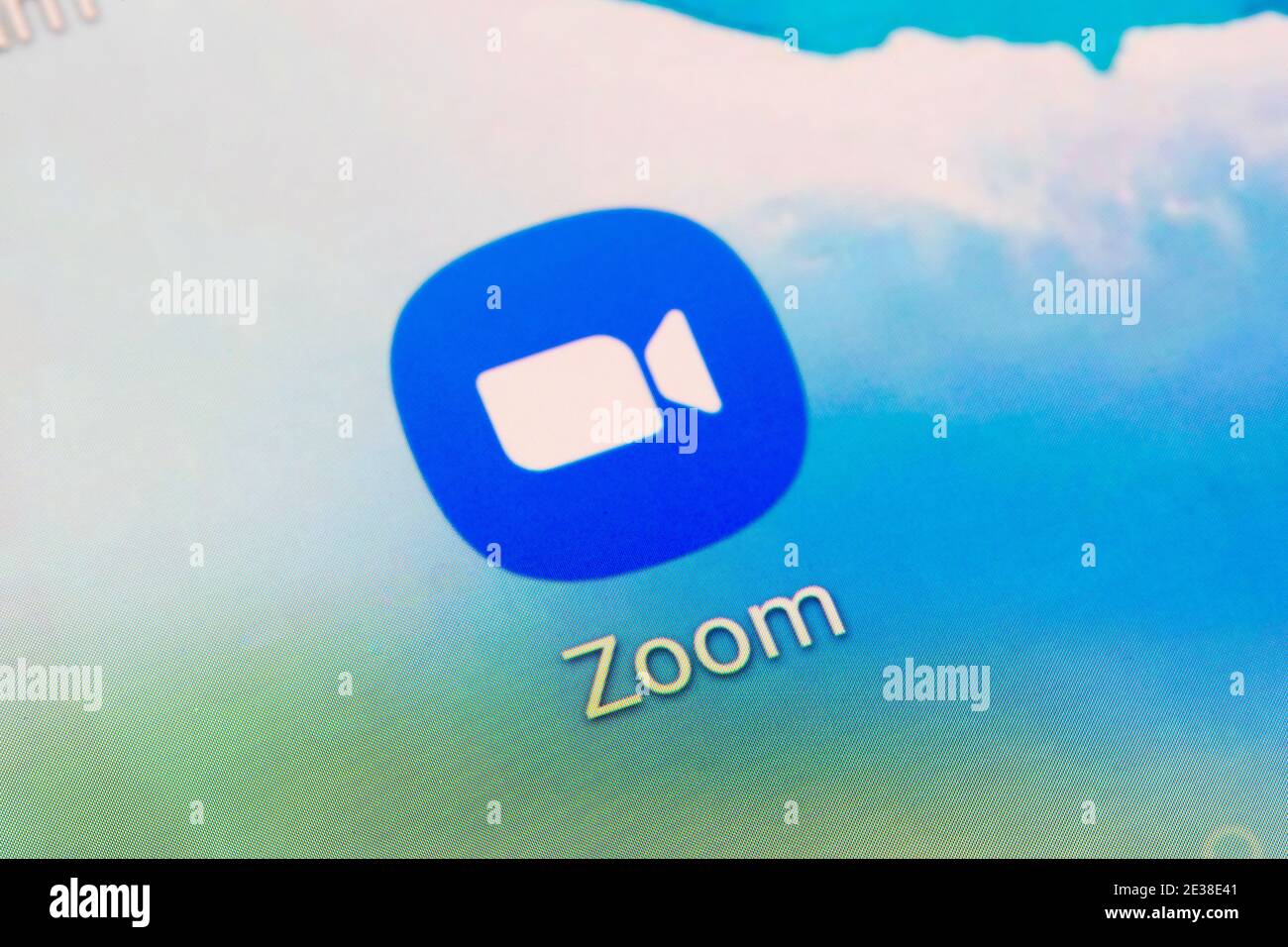 A closeup of the app logo for Zoom - a videotelephony software program developed by Zoom Video Communications Stock Photo