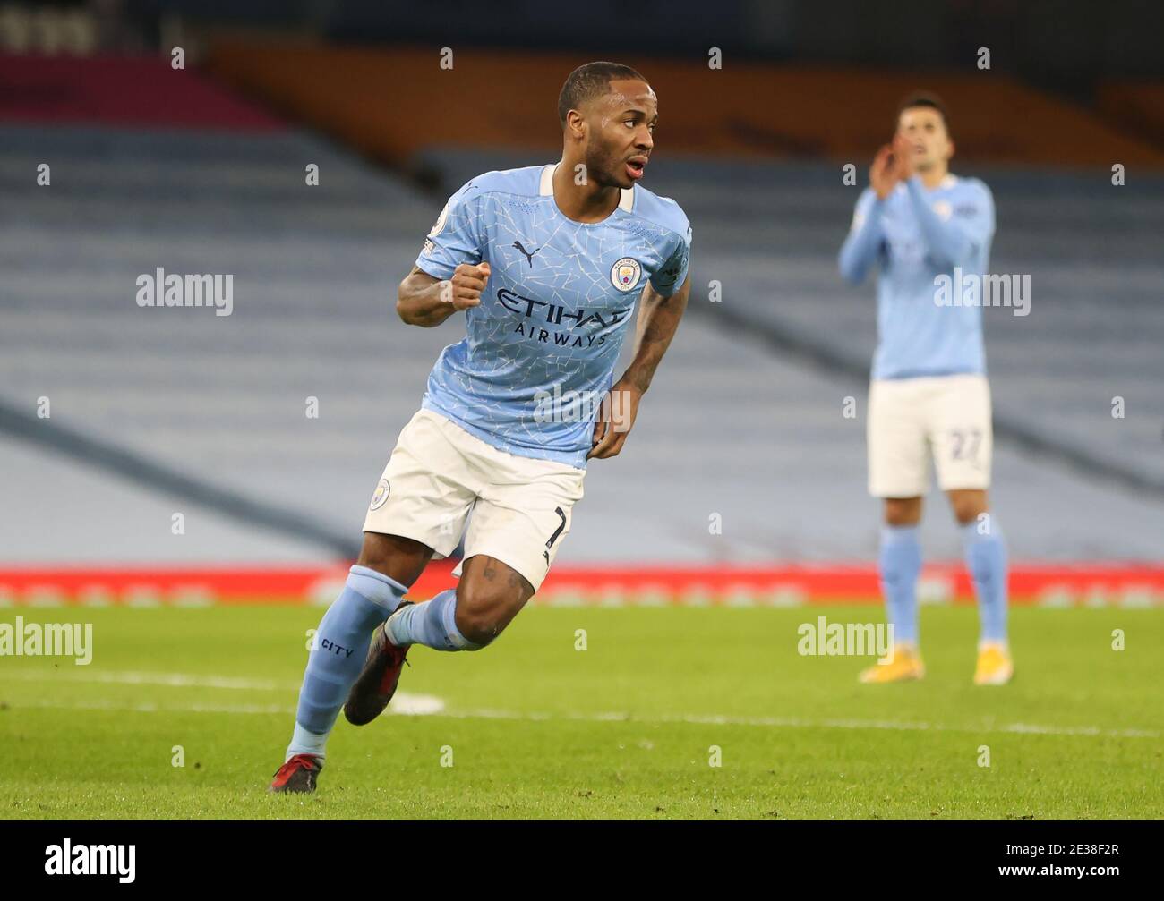 Manchester City's Raheem Sterling celebrates scoring his side's fourth goal of the game from a free-kick during the Premier League match at the Etihad Stadium, Manchester. Stock Photo