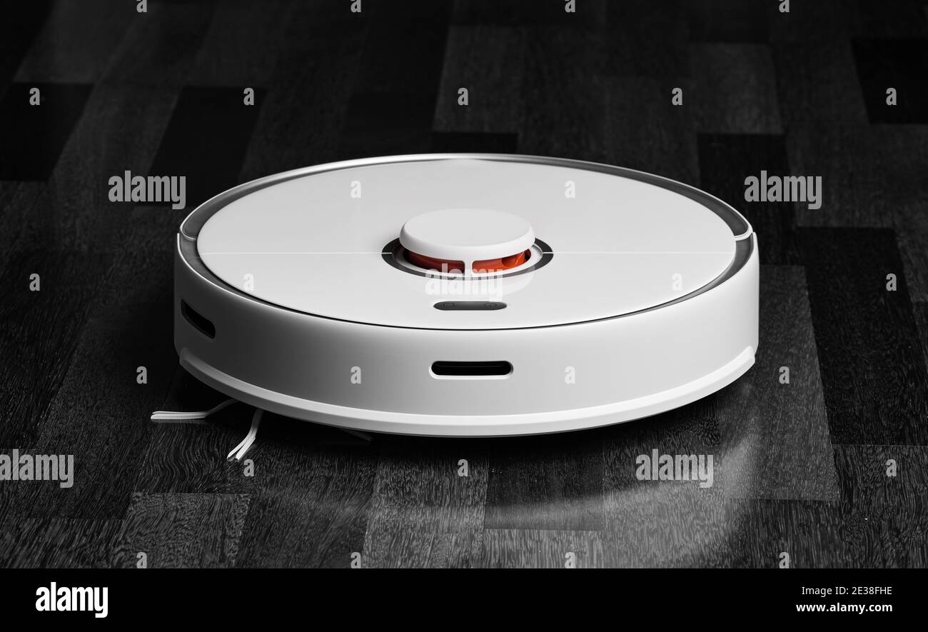 Smart Robot Vacuum Cleaner. Robot vacuum cleaner performs automatic cleaning  of the apartment at a certain time. Smart home Stock Photo - Alamy