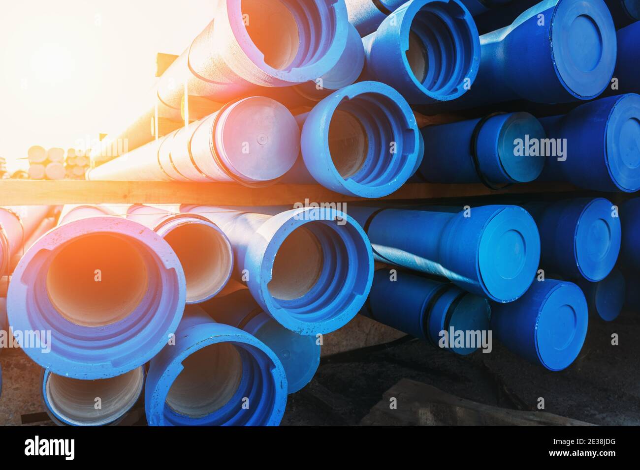 Pack of blue sewer pipe, ready to transport and install. Stock Photo