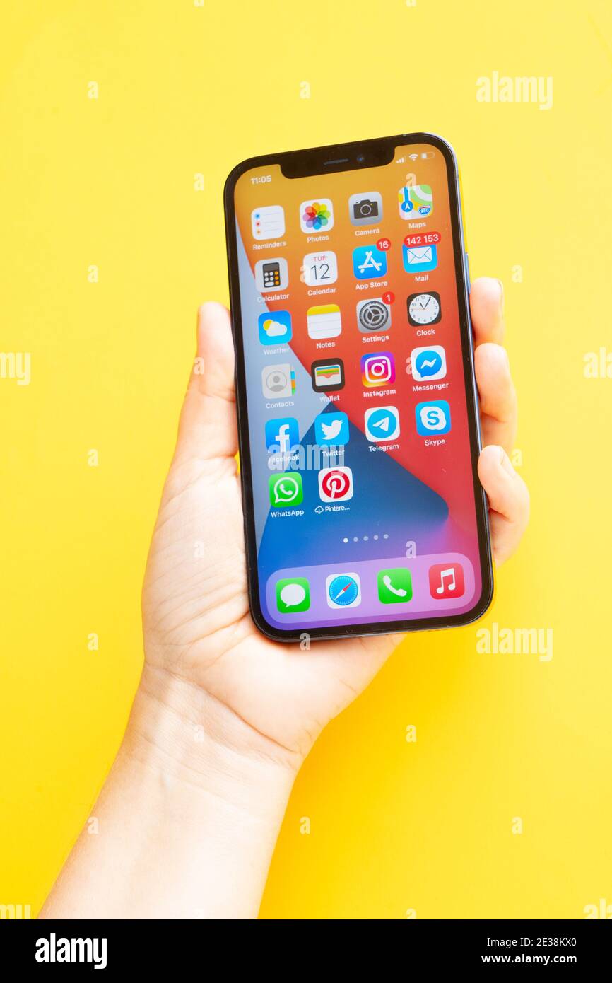 Iphone 12 pro on bright yellow background Stock Photo