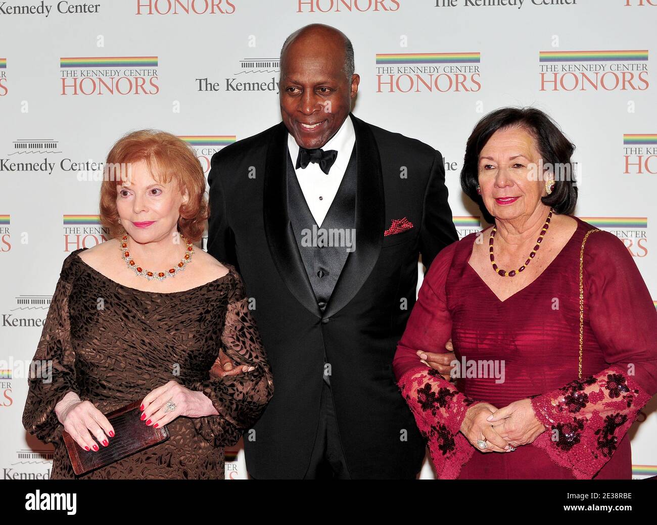 Buffy Cafritz, Vernon Jordan and Anne Jordan arrive for the formal Artist's Dinner at the United States Department of State in Washington, D.C. on Saturday, December 4, 2010. Photo By Ron Sachs/ABACAUSA.COM (Pictured: Buffy Cafritz, Vernon Jordan , Anne Jordan) Stock Photo