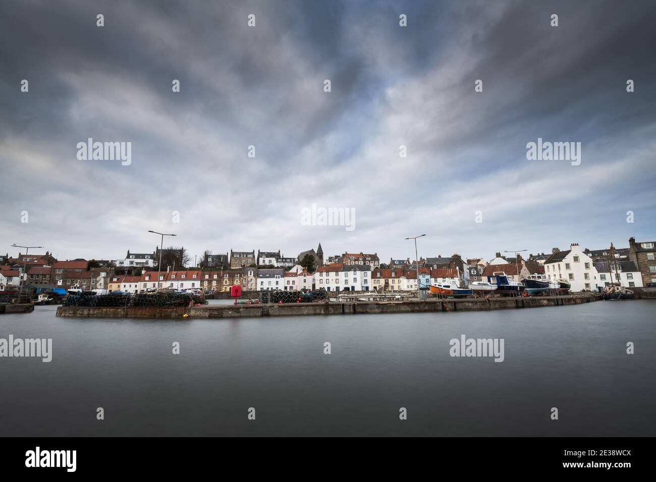 The harbour in the pretty Fife fishing village of St Monans viewed from the breakwater. Stock Photo
