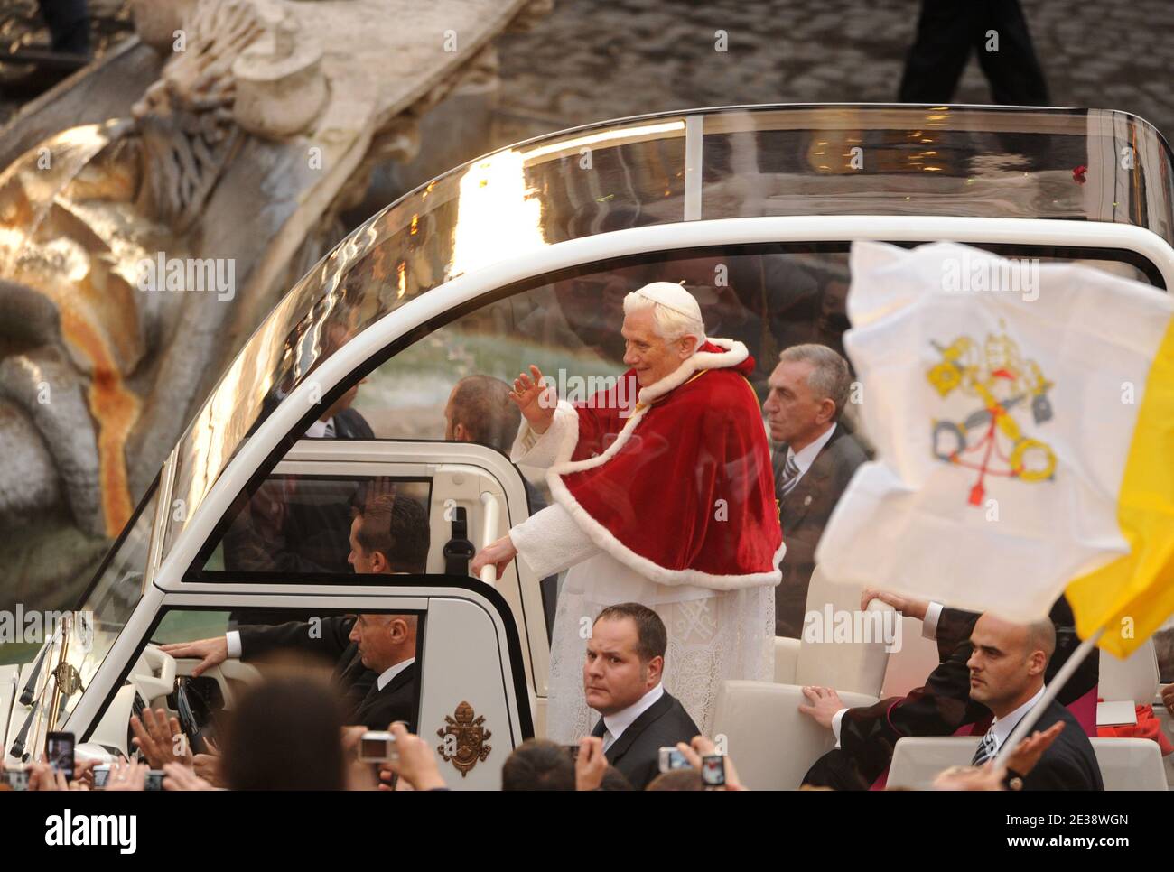 Pope Benedict XVI waves from his popemobile as he arrives for the ...