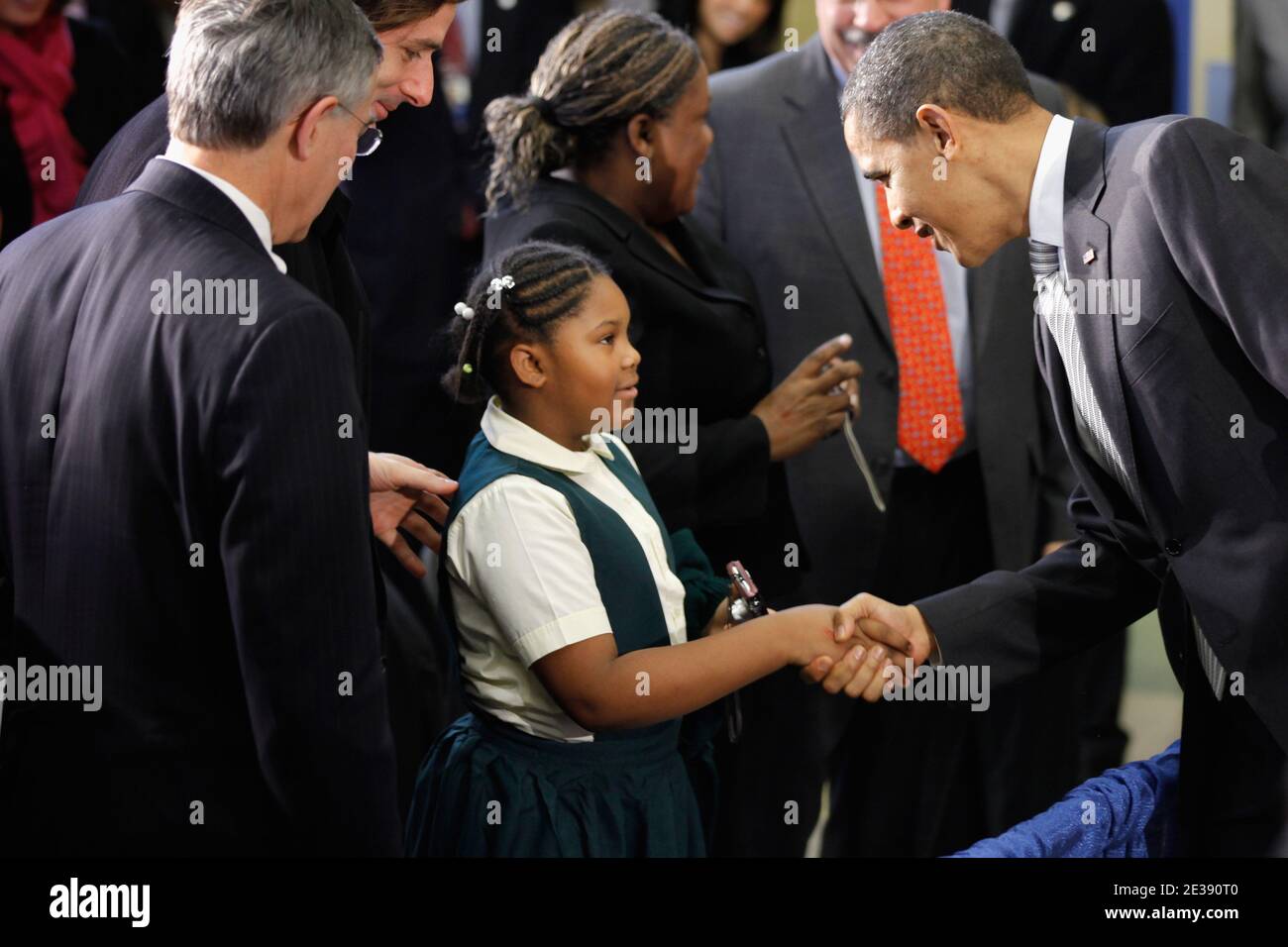 U.S. President Barack Obama (R) greets a young student after signing the Healthy, Hunger-Free Kids Act of 2010 at Harriet Tubman Elementary School in Washington, DC, USA, on December 13, 2010. In an effort to provide children with better school lunches and breakfasts, the new law puts $4.5 million in the hands of child nutrition programs, sets nutrition standards on school vending machines, helps create school gardens and makes sure that quality drinking water is available during meal times. Photo by Chip Somodevilla/ABACAPRESS.COM Stock Photo