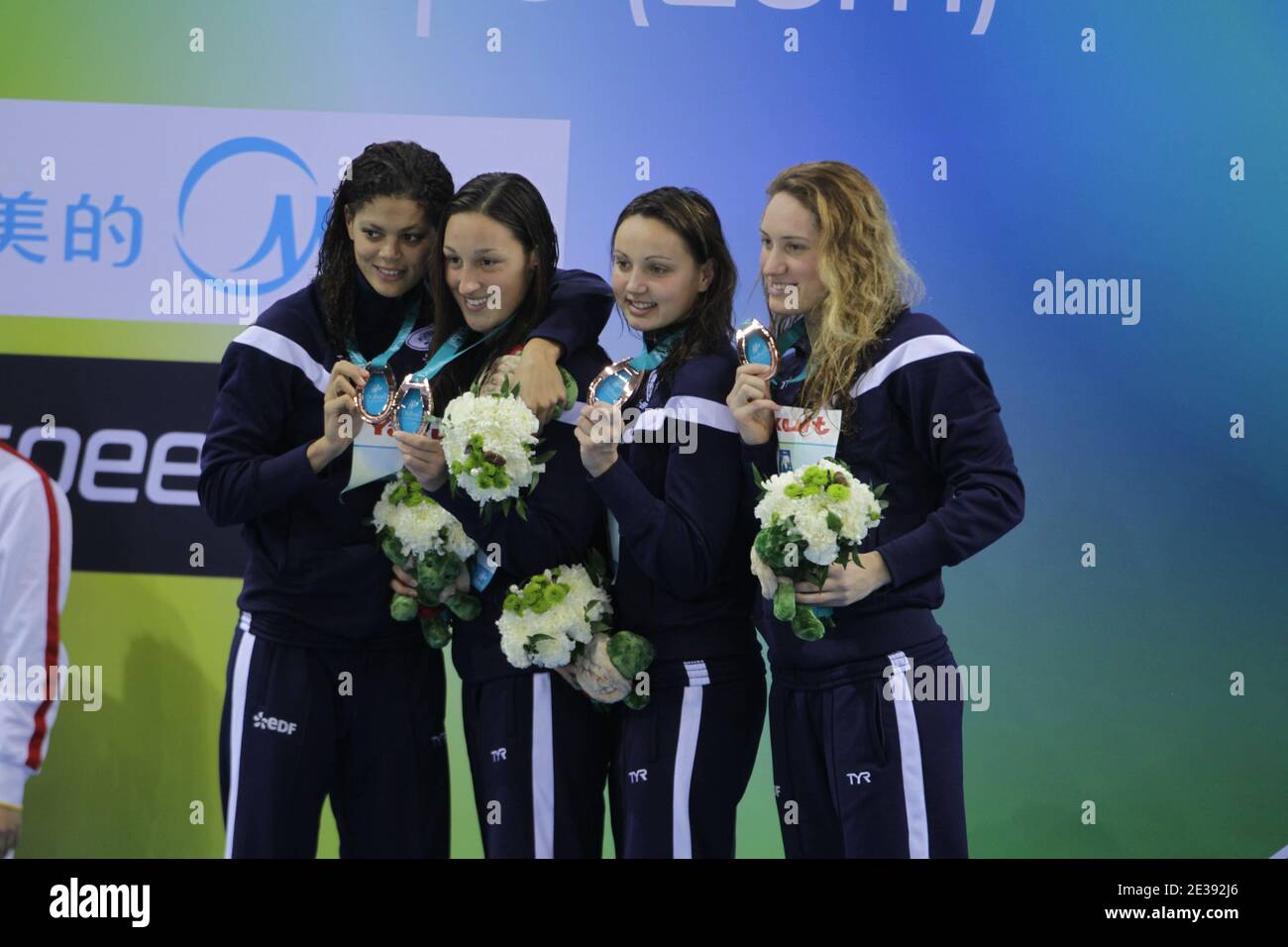 Bronze medalists Camille Muffat, Coralie Balmy, Mylene Lazare and Ophelie Cyrielle Etienne from France pose at the medal ceremony for the Women's 4x200 meter Freestyle Final during day one of the 10th FINA World Swimming Championships (25m) at the Hamdan bin Mohammed bin Rashid Sports Complex in Dubai, United Arab Emirates on December 15, 2010. Photo by Ammar Abd Rabbo/ABACAPRESS.COM Stock Photo