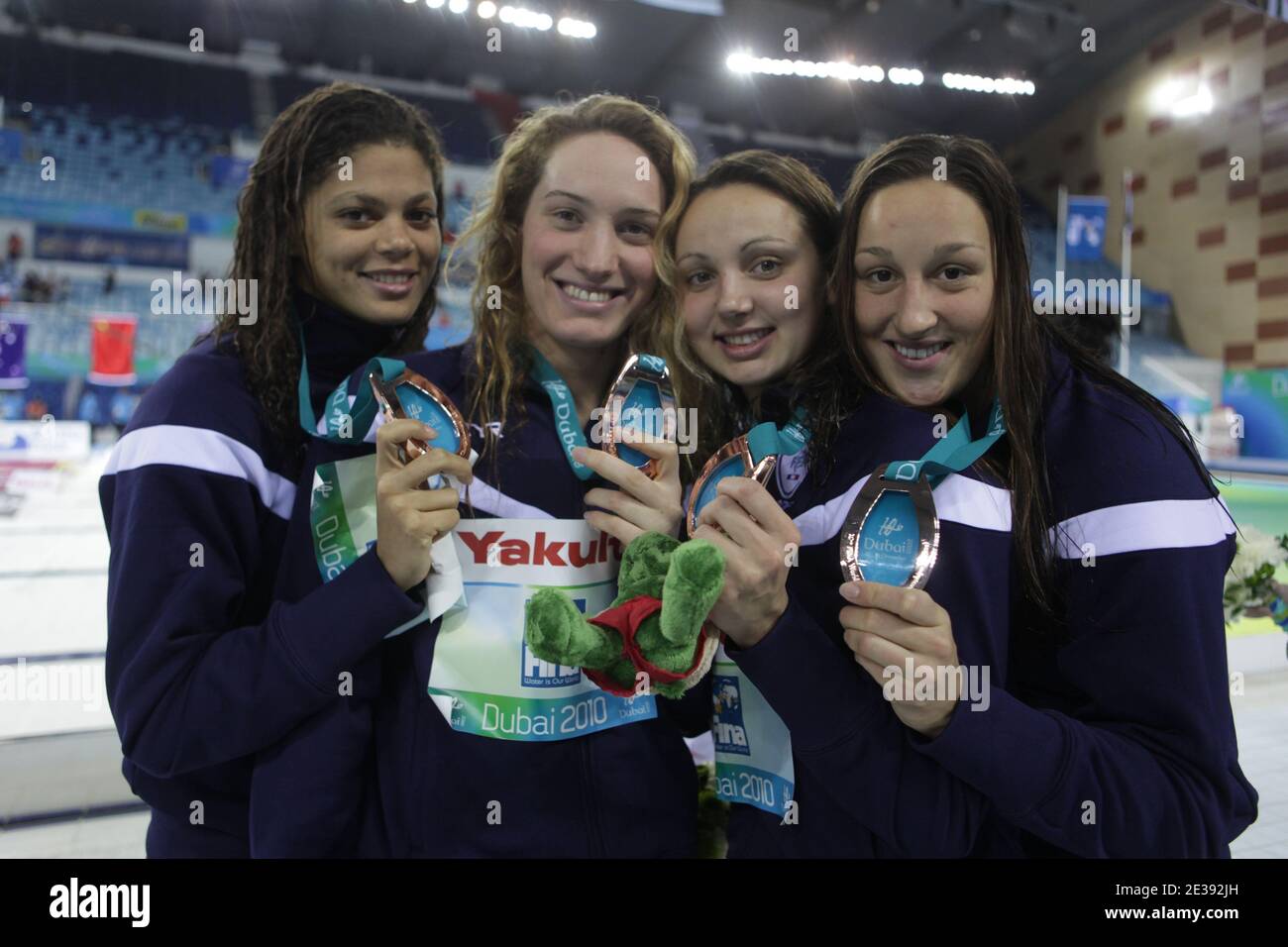Bronze medalists Camille Muffat, Coralie Balmy, Mylene Lazare and Ophelie Cyrielle Etienne from France pose at the medal ceremony for the Women's 4x200 meter Freestyle Final during day one of the 10th FINA World Swimming Championships (25m) at the Hamdan bin Mohammed bin Rashid Sports Complex in Dubai, United Arab Emirates on December 15, 2010. Photo by Ammar Abd Rabbo/ABACAPRESS.COM Stock Photo