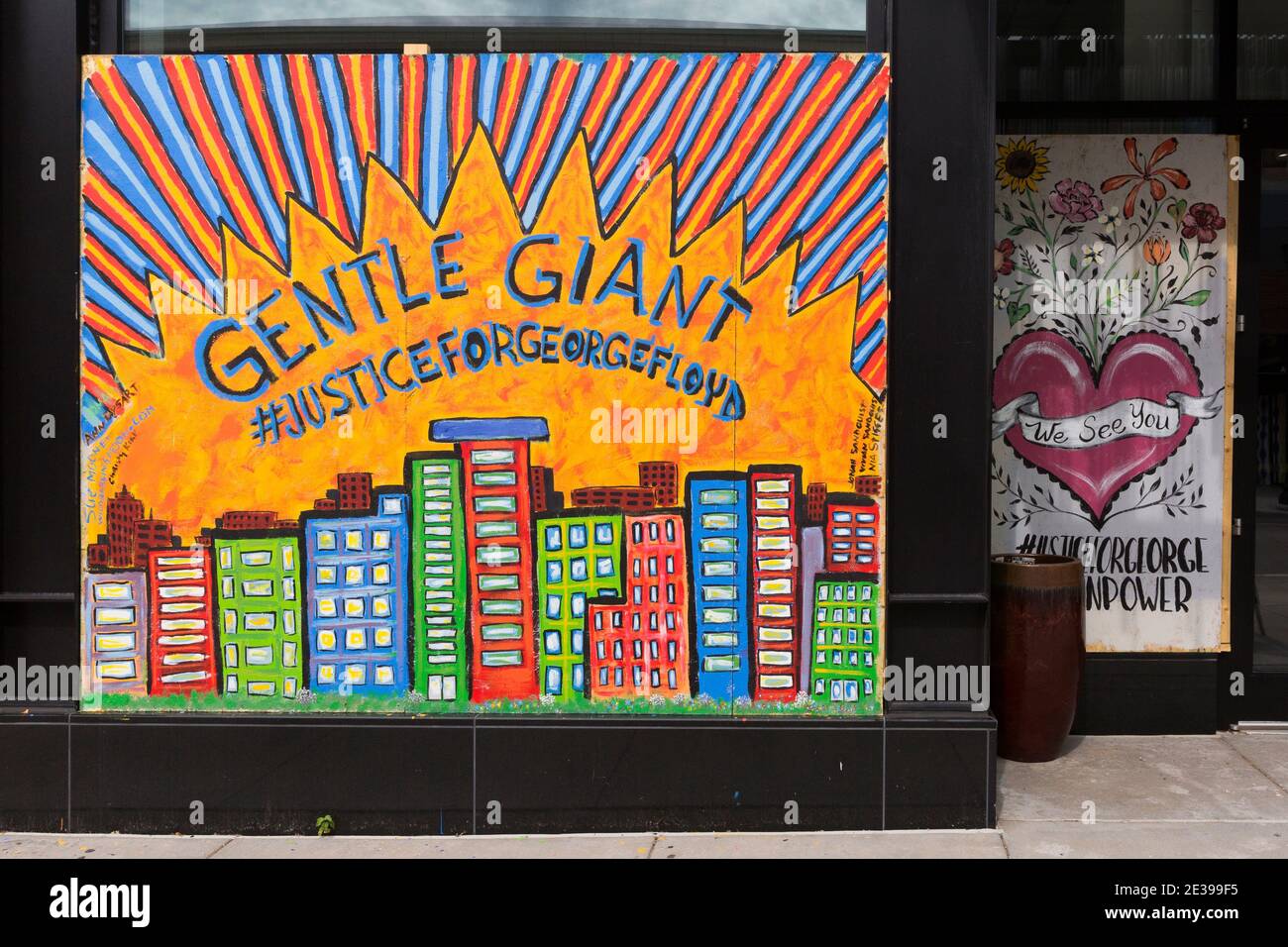 Mural on a boarded-up business window in Minneapolis during civil unrest after the killing of George Floyd with the hashtag #JUSTICEFORGEORGEFLOYD Stock Photo