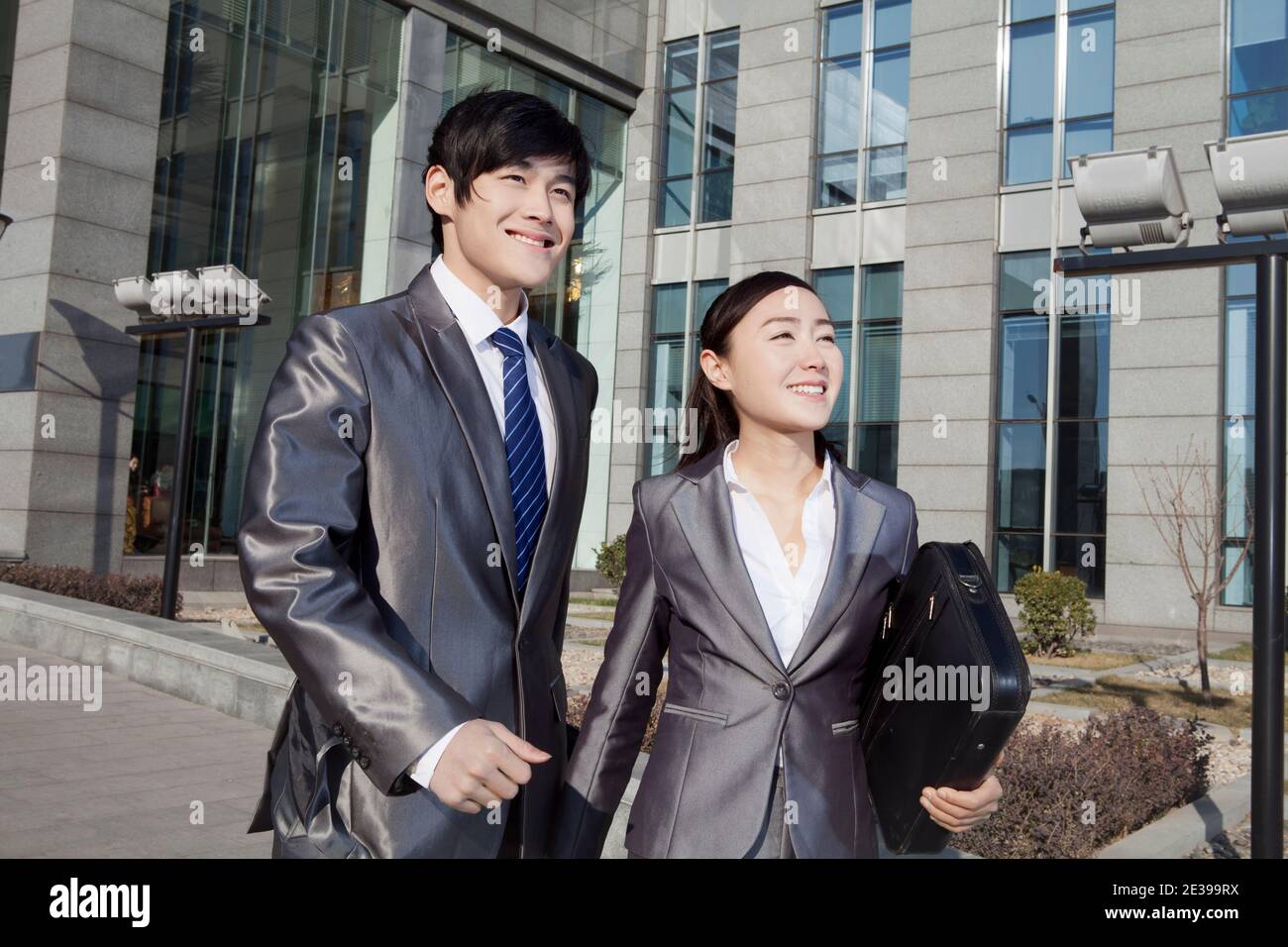 Business man and business woman walking to work high quality photo Stock Photo