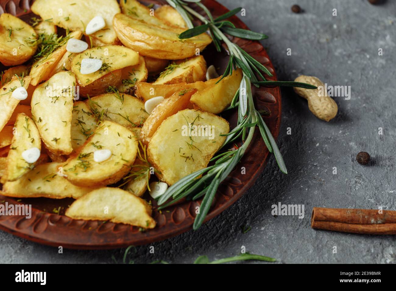 roasted rosemary garlic potato wedges on a plate Stock Photo Alamy