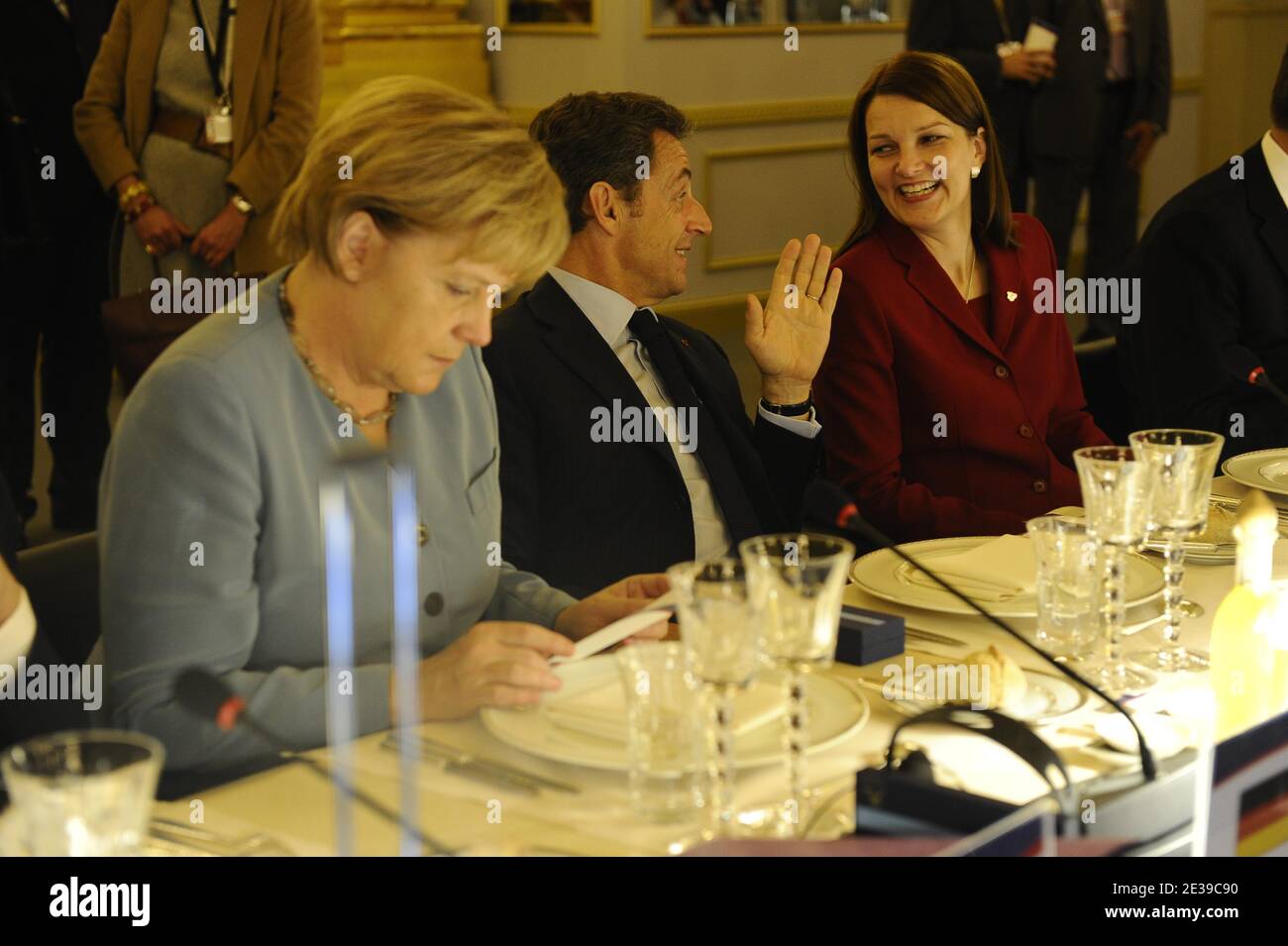 French President Nicolas Sarkozy (C), German Chancellor Angela Merkel (L) and Finland's Prime Minister Mari Kiviniemi (R) are picture during the ASEM 8 summit in Brussels, Belgium on October 4, 2010. European and Asian leaders will seek common ground on ways to fix and regulate the global financial market but will likely be bogged down by such issues as market restrictions and trade surpluses during three days of summits. Photo by Elodie Gregoire/ABACAPRESS.COM Stock Photo