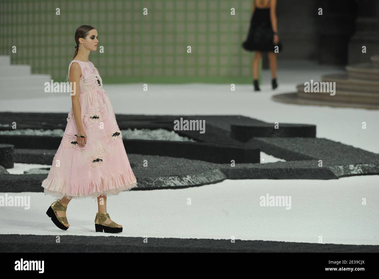 A model displays a creation by Karl Lagerfeld for Chanel spring-summer 2011  ready-to wear collection presentation held at the Grand Palais in Paris,  France on October 5, 2010. Photo by Thierry Orban/ABACAPRESS.COM