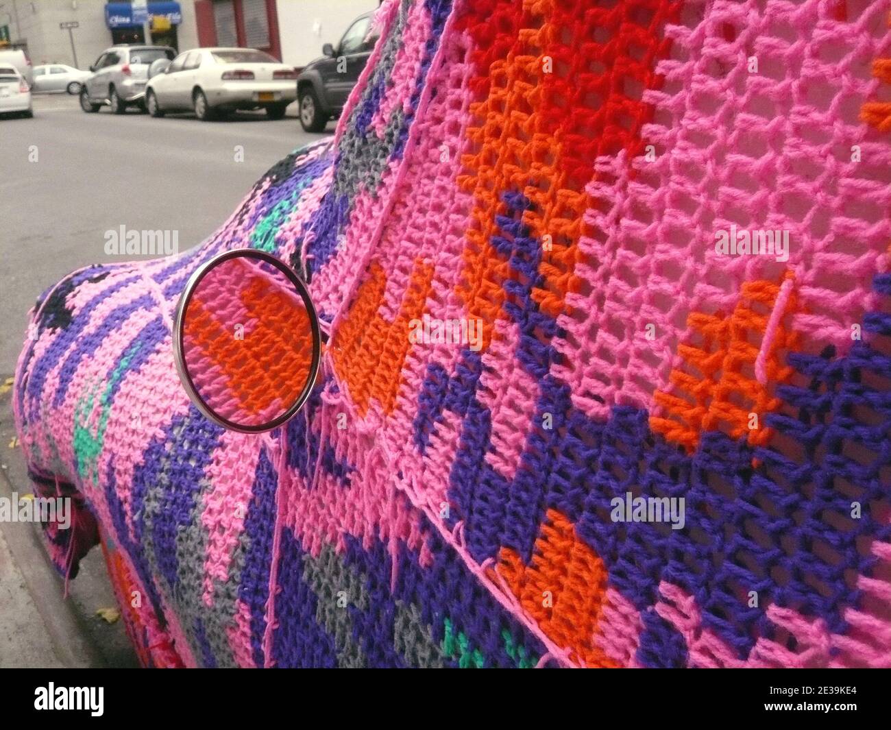 Car and Bike crocheted on the street front of the Christopher Henry Gallery in The East Village in New York, NY, USA on October 16, 2010. 'Knitting Is for Pus' exhibit by Polish artist Olek. As if itÍs not impressive enough that a miniature studio apartment was built inside the gallery on the ground floor, Olek crocheted every item inside it! Photo by Charles Guerin/ABACAPRESS.COM Stock Photo