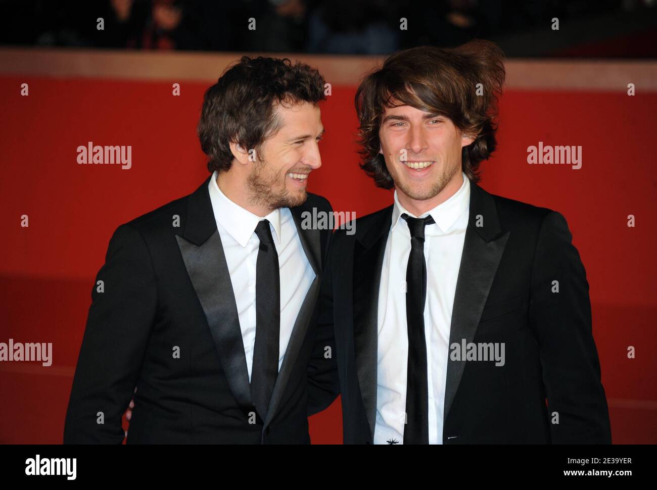 French actor/director Guillaume Canet poses on the red carpet with cast  member Hugo Selignac prior to the screening of his film 'Little White Lies'  (Les petits mouchoirs) during the 5th International Rome