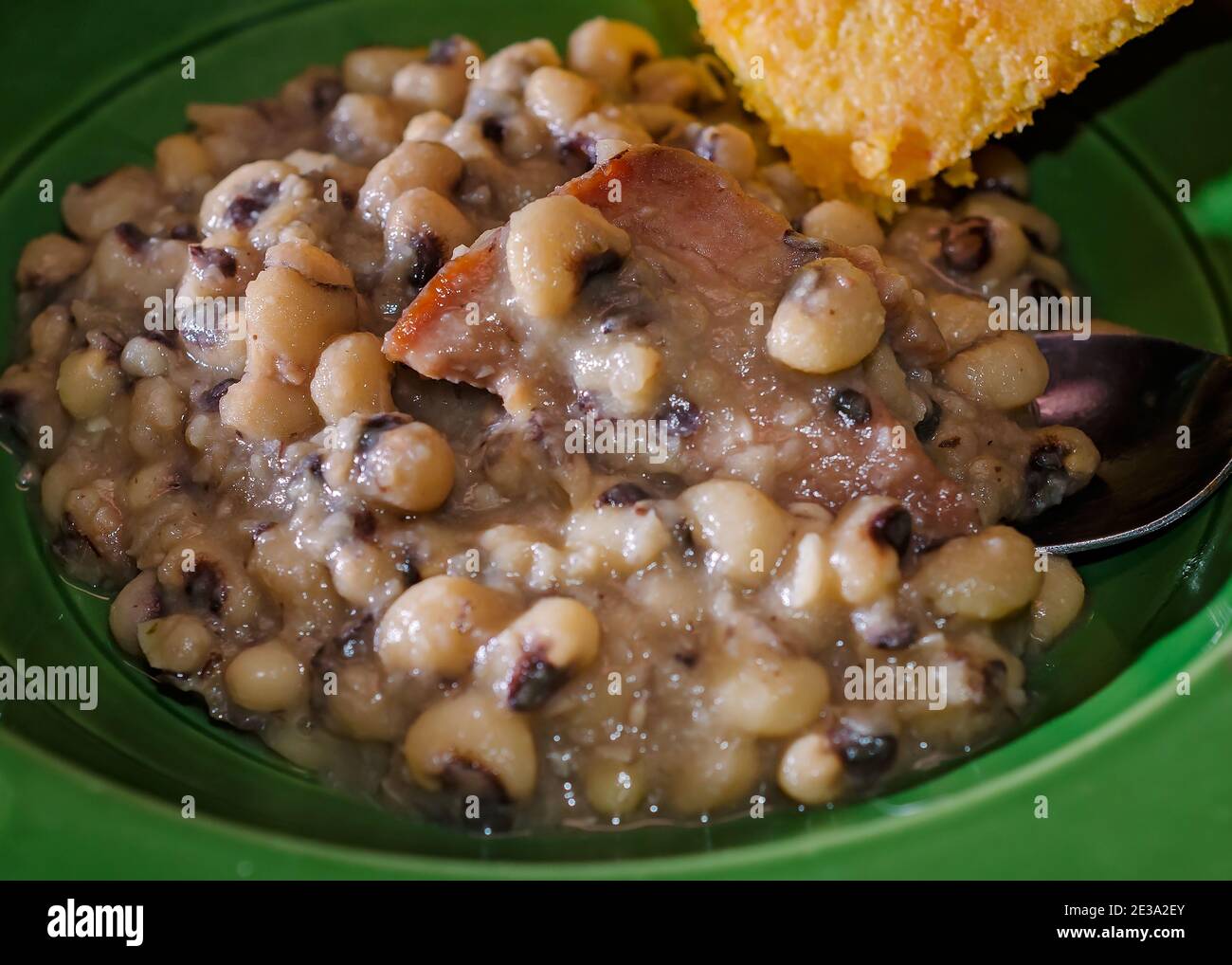 Black-eyed peas, also known as Hoppin’ John, is served with cornbread as a traditional New Year’s Day dinner in the Southern United States. Stock Photo