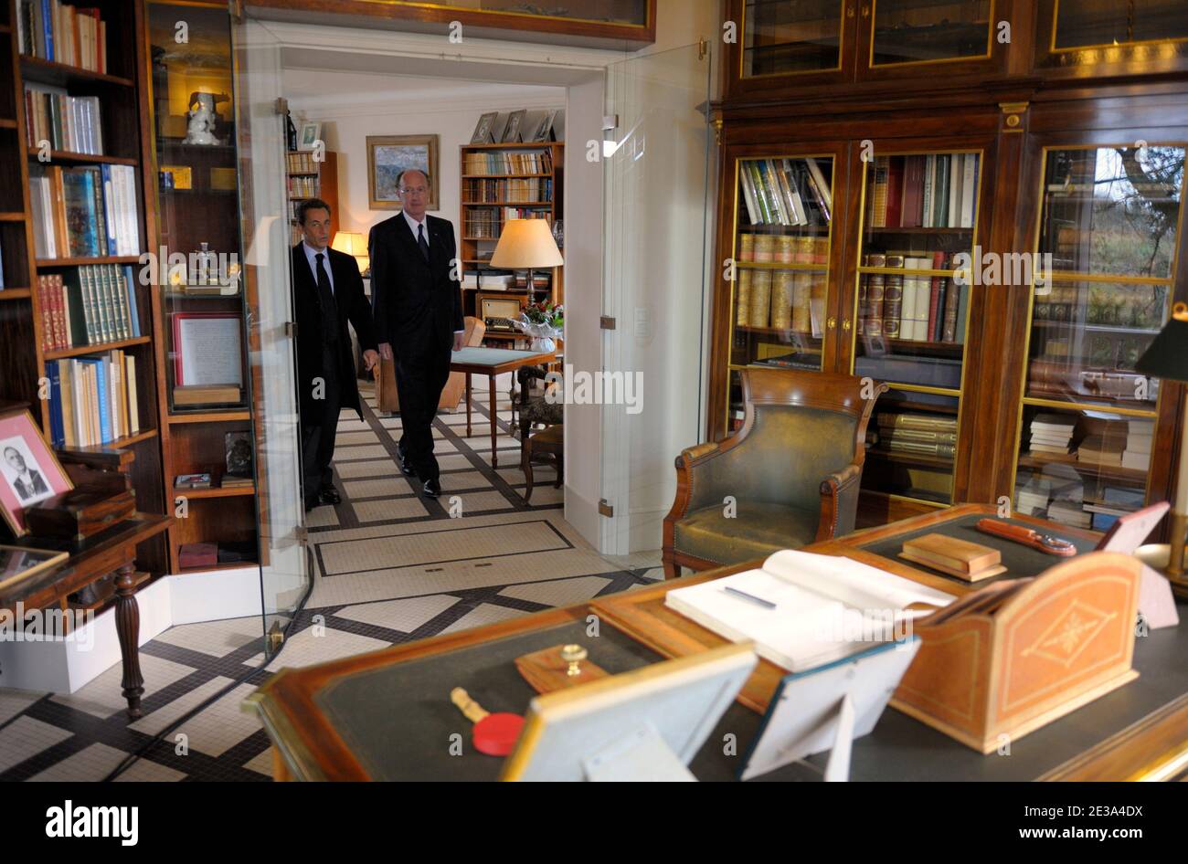 French President Nicolas Sarkozy (L) and Charles de Gaulle's grandson Yves de  Gaulle visit Charles de Gaulle's office in his house 'La Boisserie' during  a ceremony to mark the 40th anniversary of