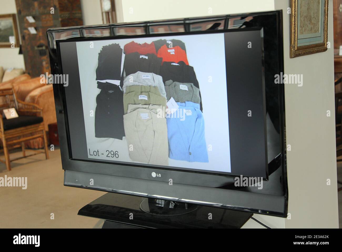 A television screen displays items that will be sold off during a press preview of a U.S. Marshals Service auction of personal property seized from Bernard and Ruth Madoff in New York City, NY, USA on November 10, 2010. Photo by Elizabeth Pantaleo/ABACAPRESS.COM Stock Photo