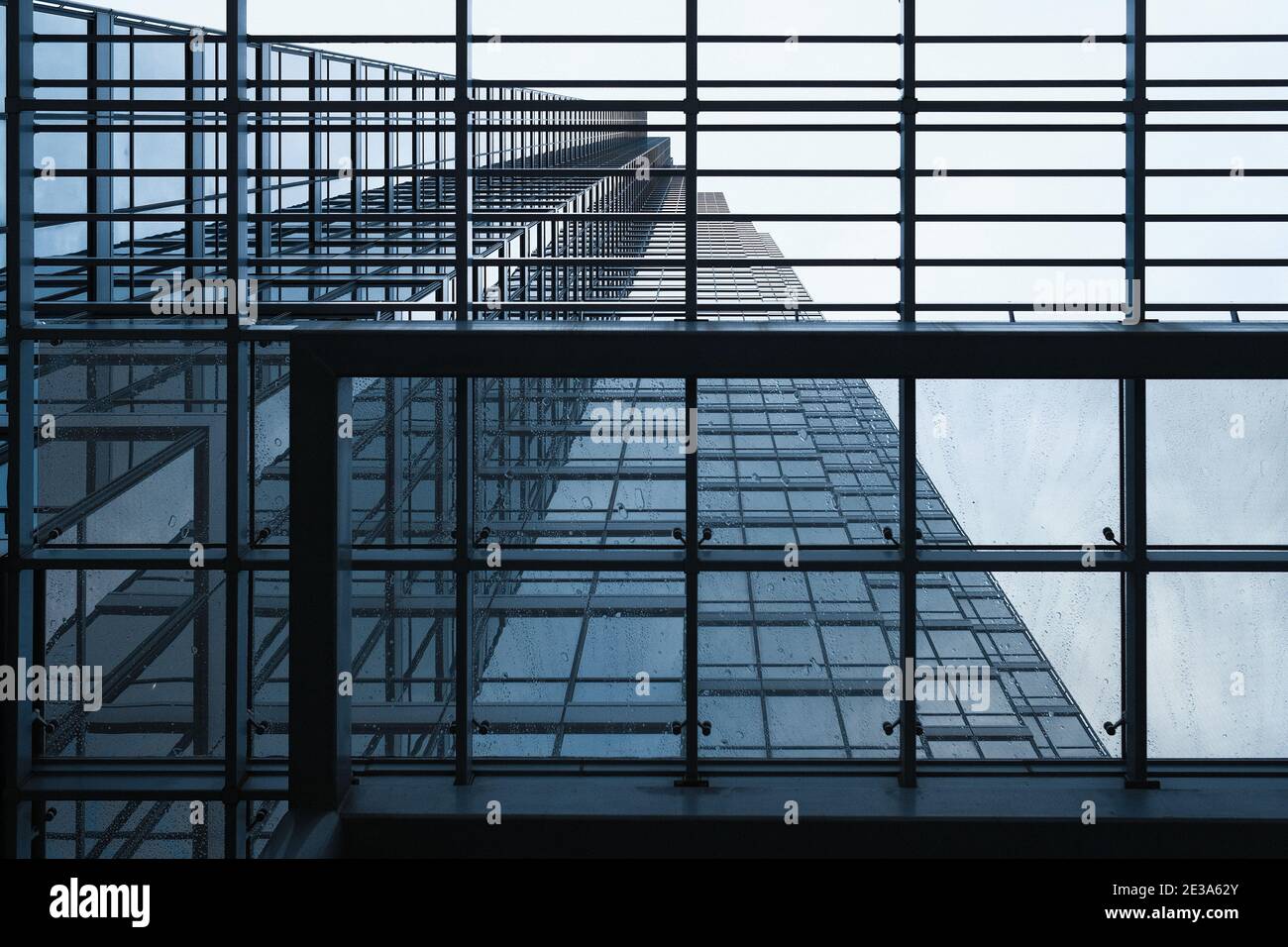 looking upwards upon the  facade of a modern glass and steel skyscraper (bank of America Plaza) in downtown Dallas revealing a pattern of squares Stock Photo