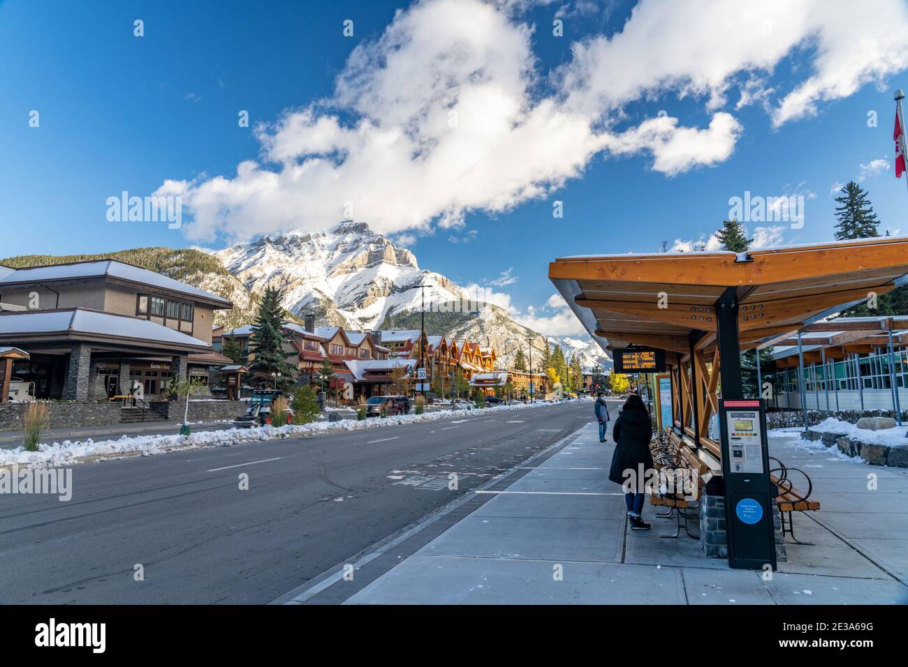 Banff High School Transit Hub bus stop. Banff Avenue in a snowy sunny day. Canadian Rockies. Stock Photo