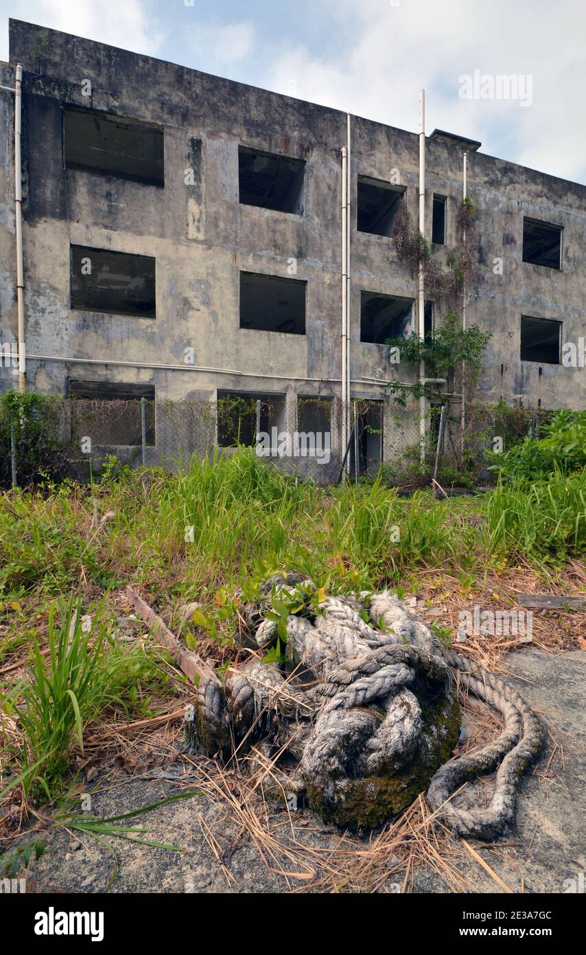MaWan ghost village in Hong Kong, abandoned and forgotten buildings after a new bridge was built over the island. Homes just left to the elements. Stock Photo