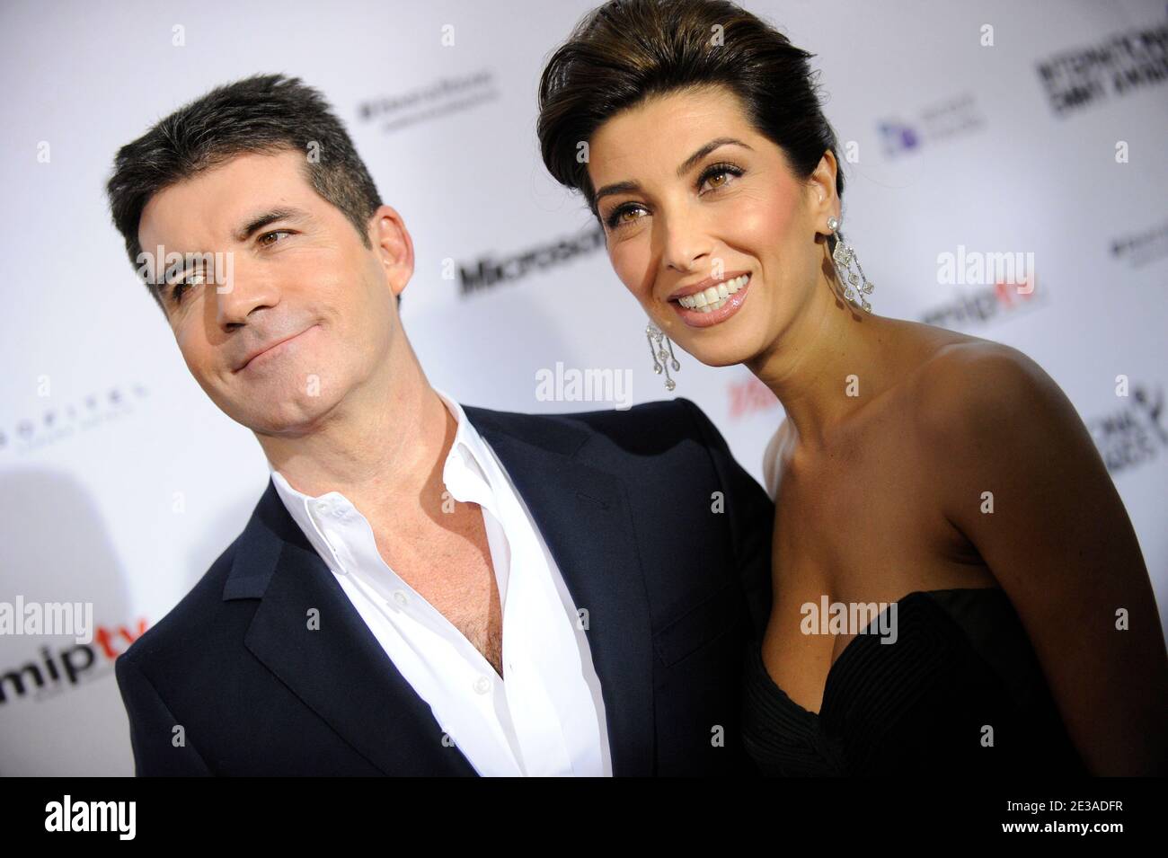 British television producer Simon Cowell and fiancee Mezhgan Hussainy  arriving for the 2010 International Emmy Awards