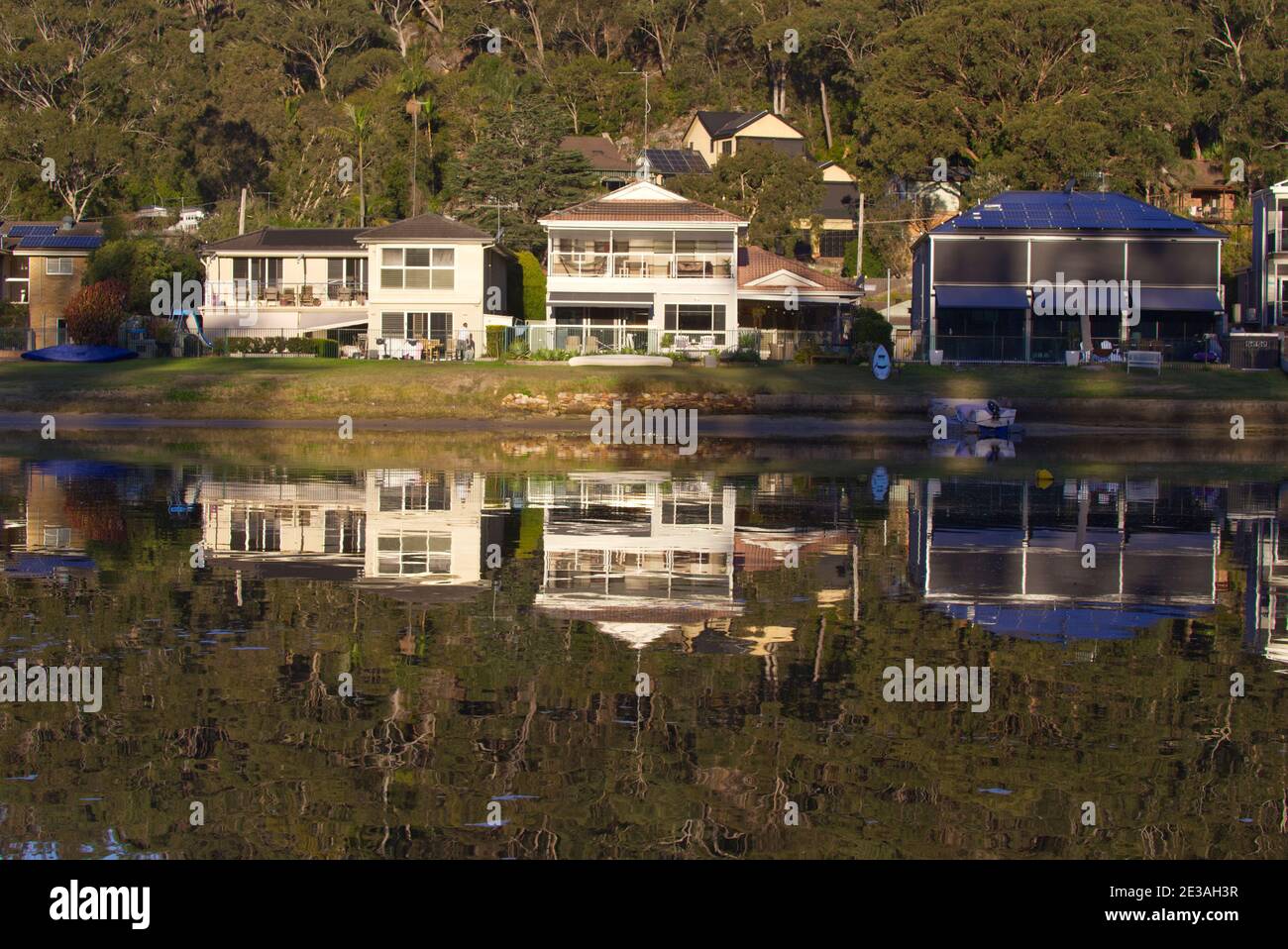 Reflections in the water of luxury waterfront houses Woronora