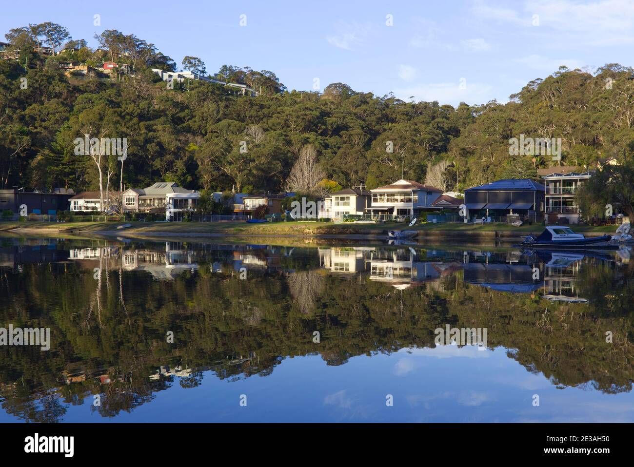 Reflections in the water of luxury waterfront houses Woronora