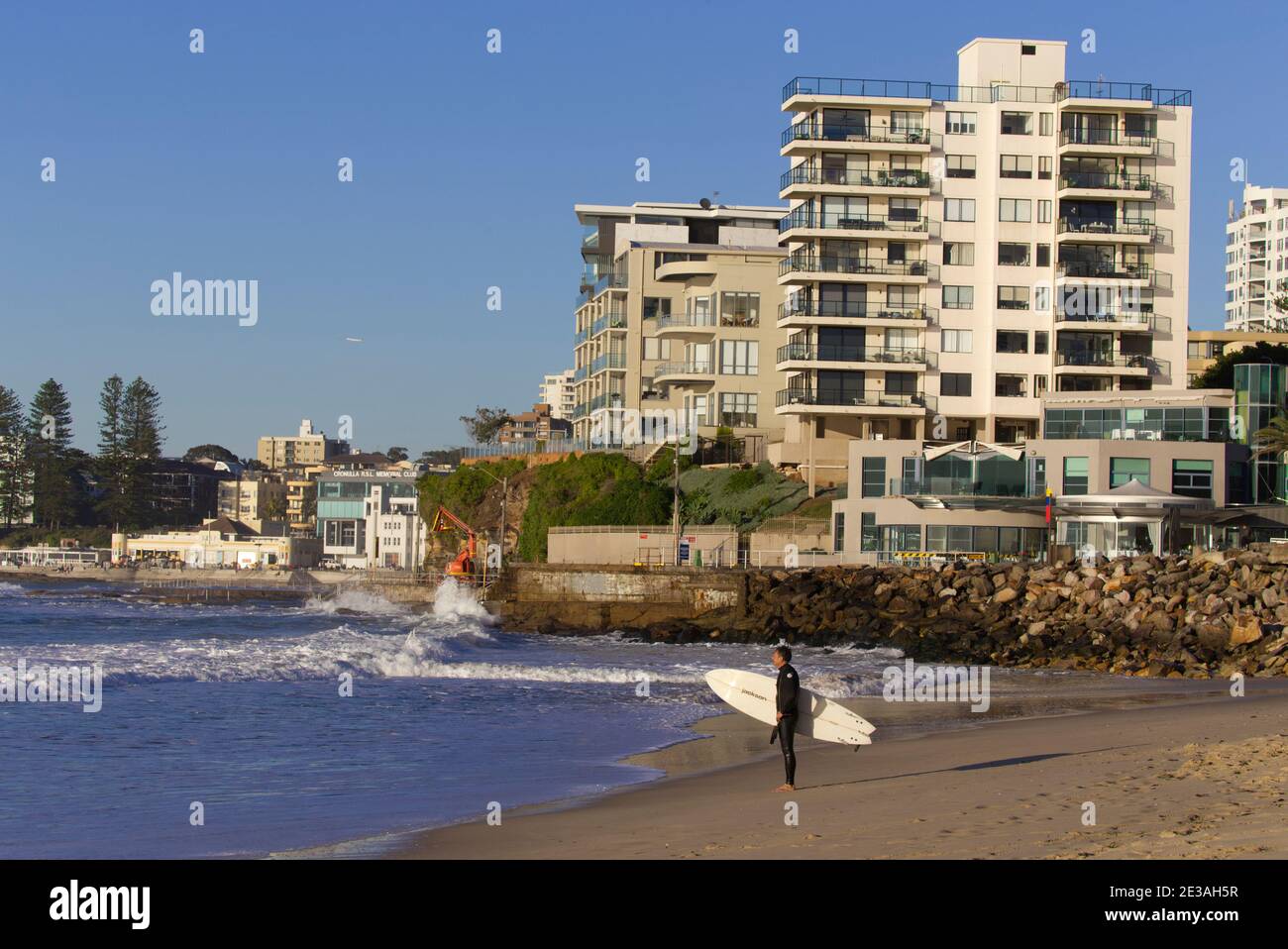 Early morning surfer at Cronulla Sutherland Shire Sydney New South Wales Australia Stock Photo