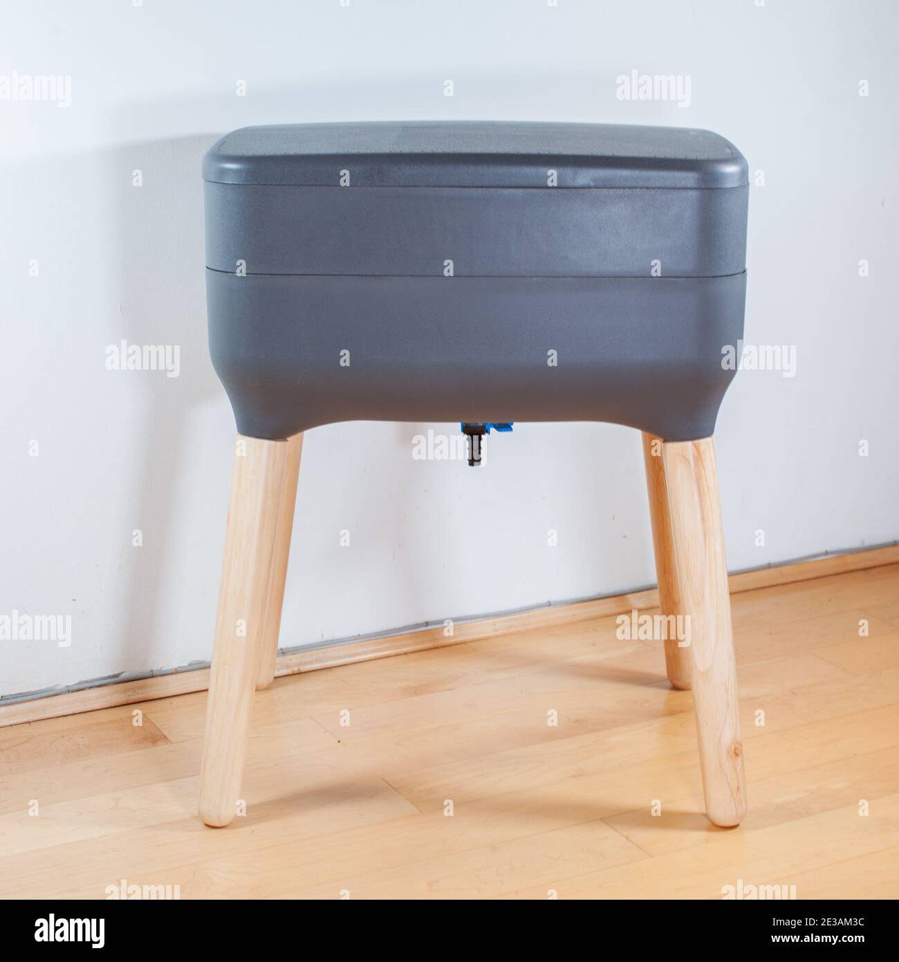 A sleek, modern looking indoor worm composter is the perfect solution for apartment living, and composting your household kitchen waste! This 2 tier w Stock Photo