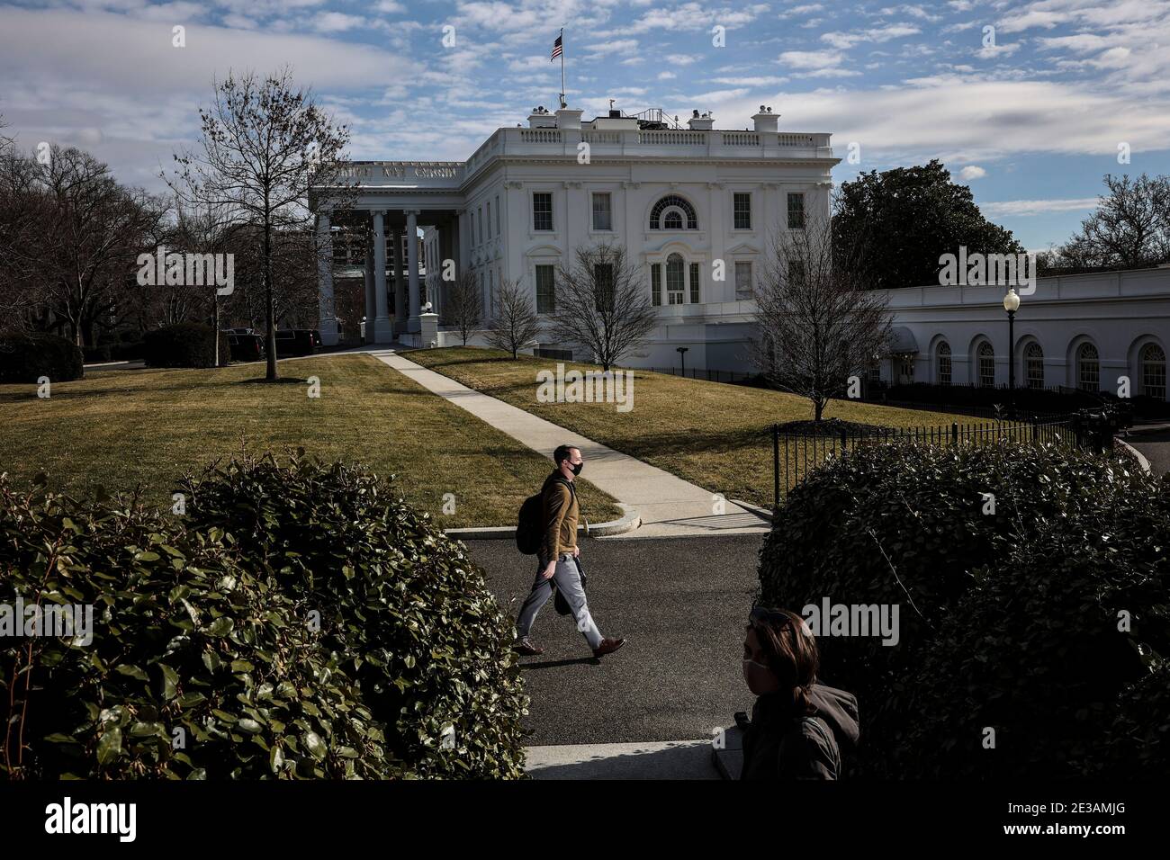 A person walks on the North Lawn of the White House on January 17, 2021 in Washington, DC., as the city prepares for the inauguration of the President elect Joe Biden.Credit: Oliver Contreras/Pool via CNP | usage worldwide Stock Photo