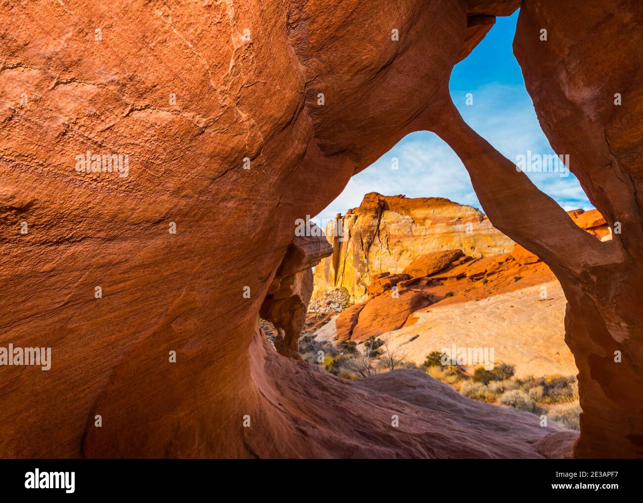 Fire Cave Arch With The White Domes in the Distance, Valley of Fire State Park, Nevada, USA Stock Photo