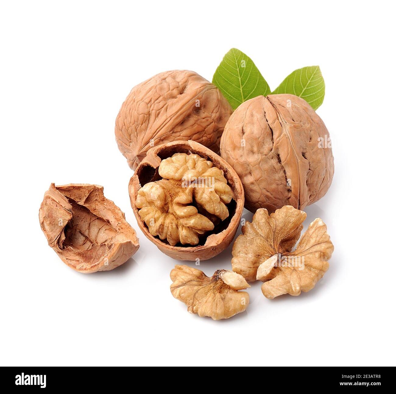 Walnuts with leaves isolated on white backgrounds. Stock Photo