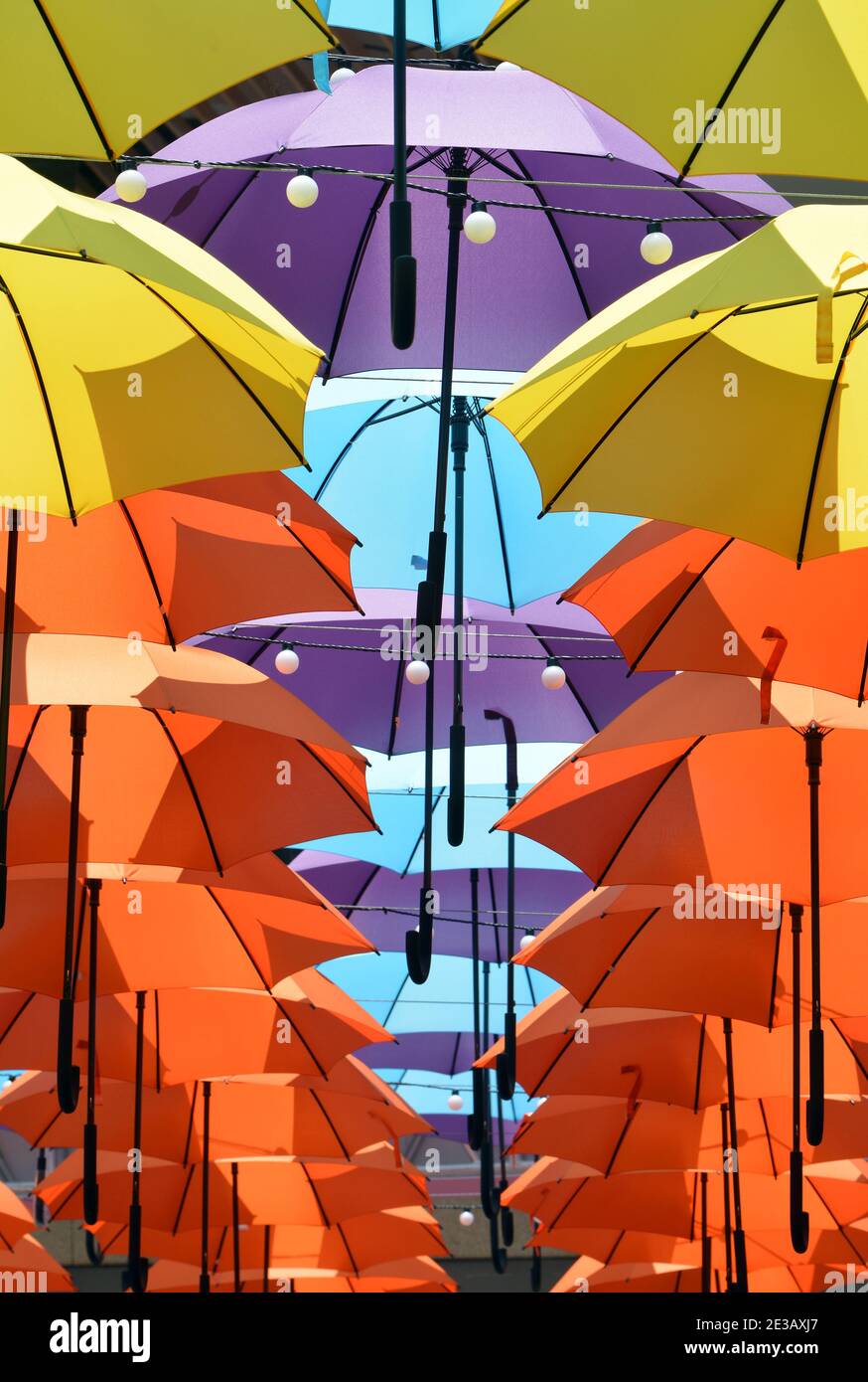 Plenty of umbrellas shelter shoppers from the sun in Shenzhen, China. Rows  of colourful brollies to keep the sun out. Lots of interesting patterns  Stock Photo - Alamy