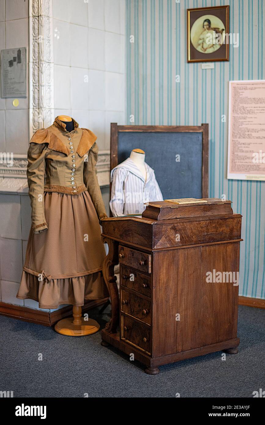 A school display with children's clothing at the Volkonsky Manor at the Irkutsk Regional Historic Memorial Decembrists' Museum. Stock Photo